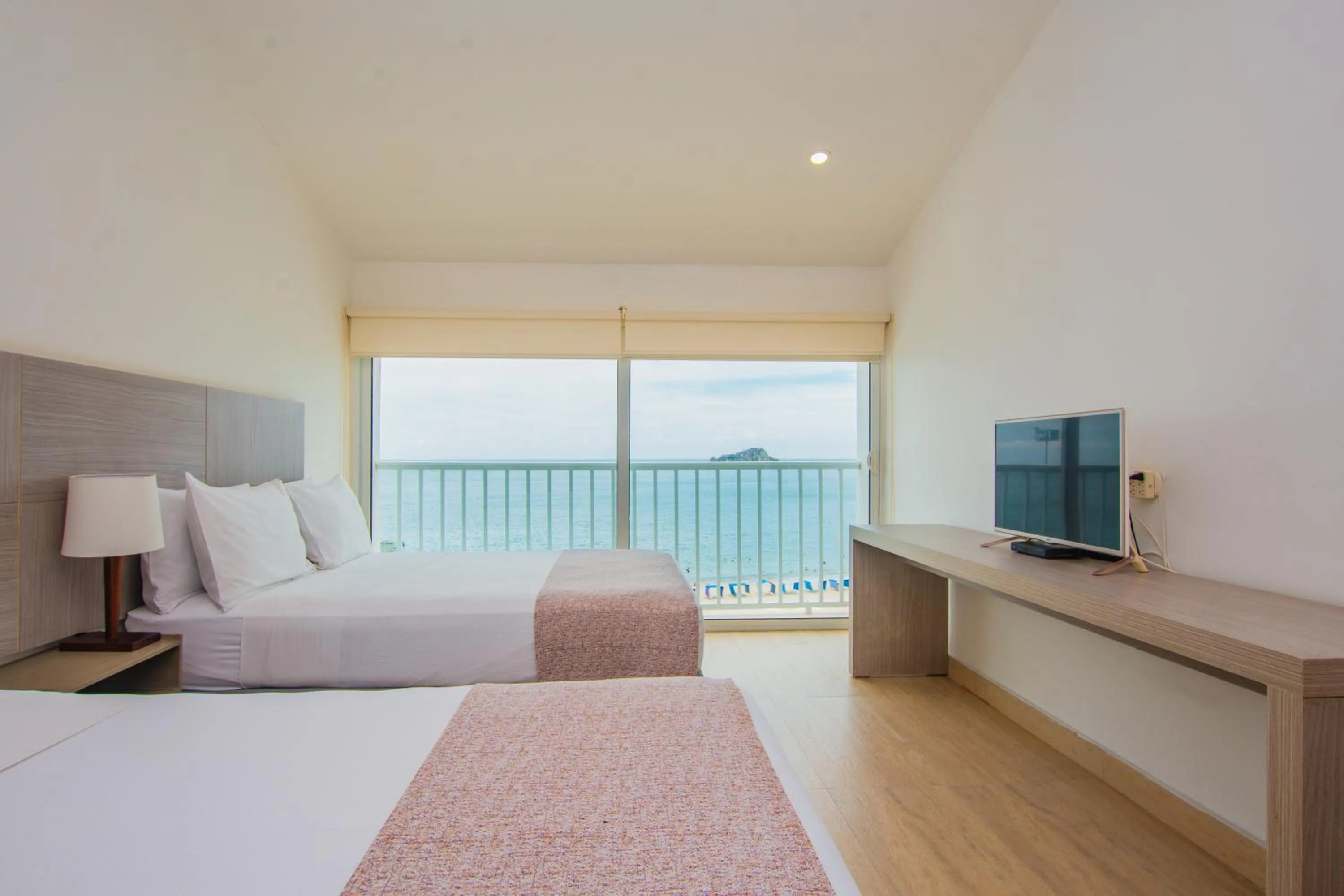 Photo of the whole room, Bed in Tamaca Beach Resort