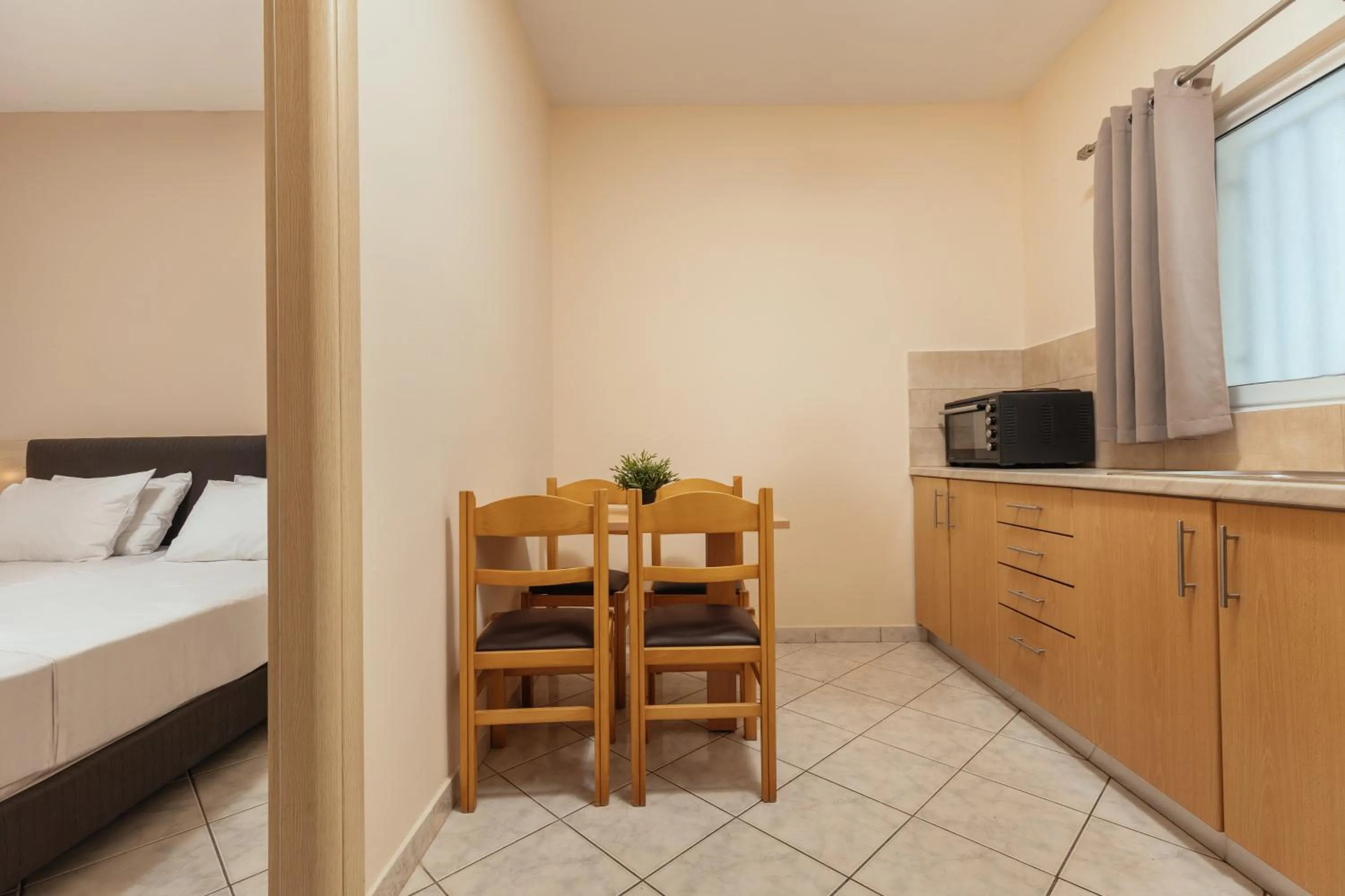 Bed in Yakinthos Hotel