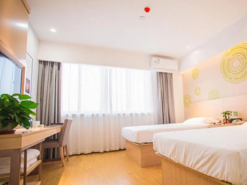 Bed in GreenTree Inn Yangzhou Jiangdu Xiaoji Town South Zhongxing Road Express Hotel