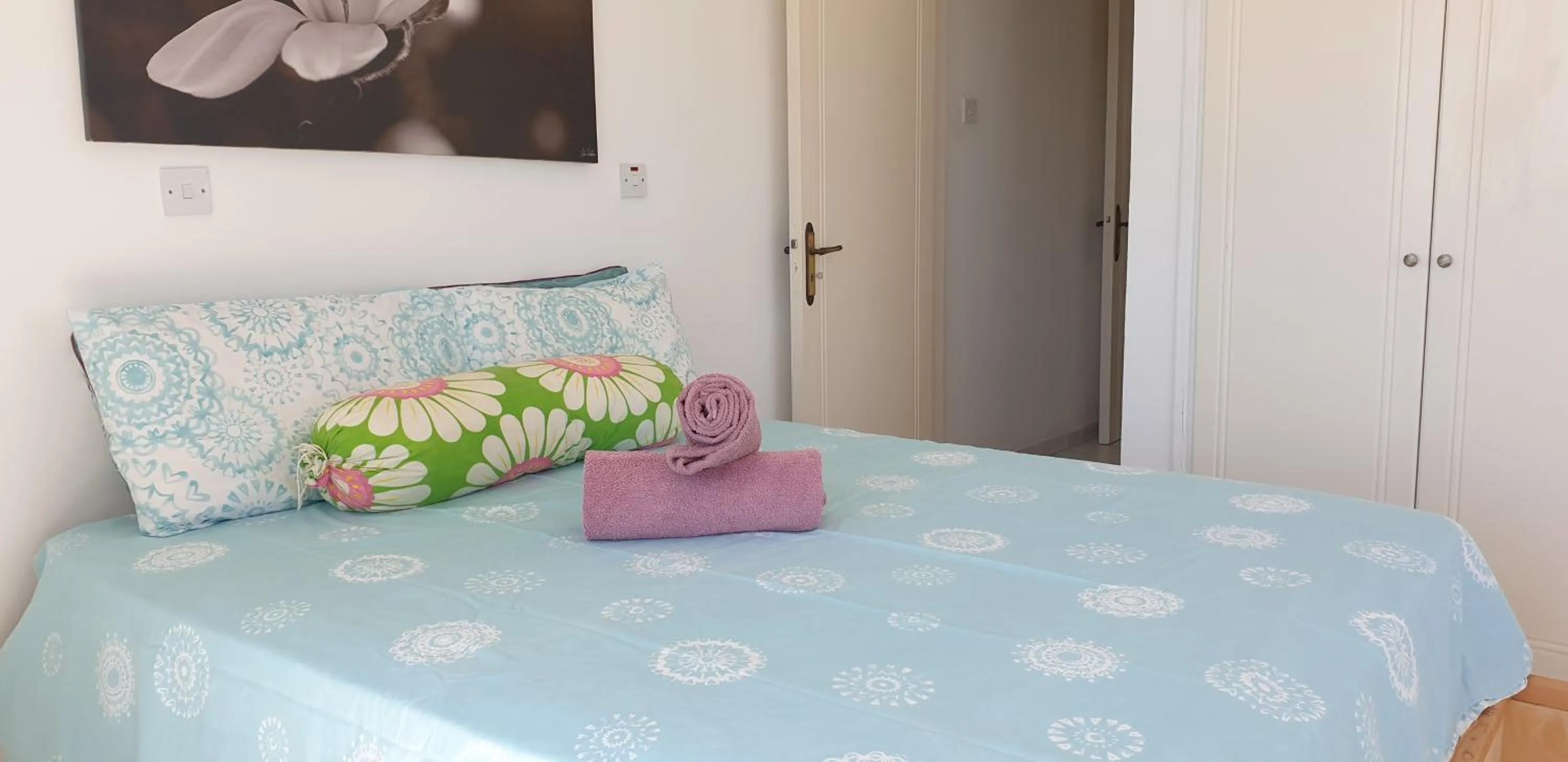 Bed in Athena and The Owl Beachside Apt