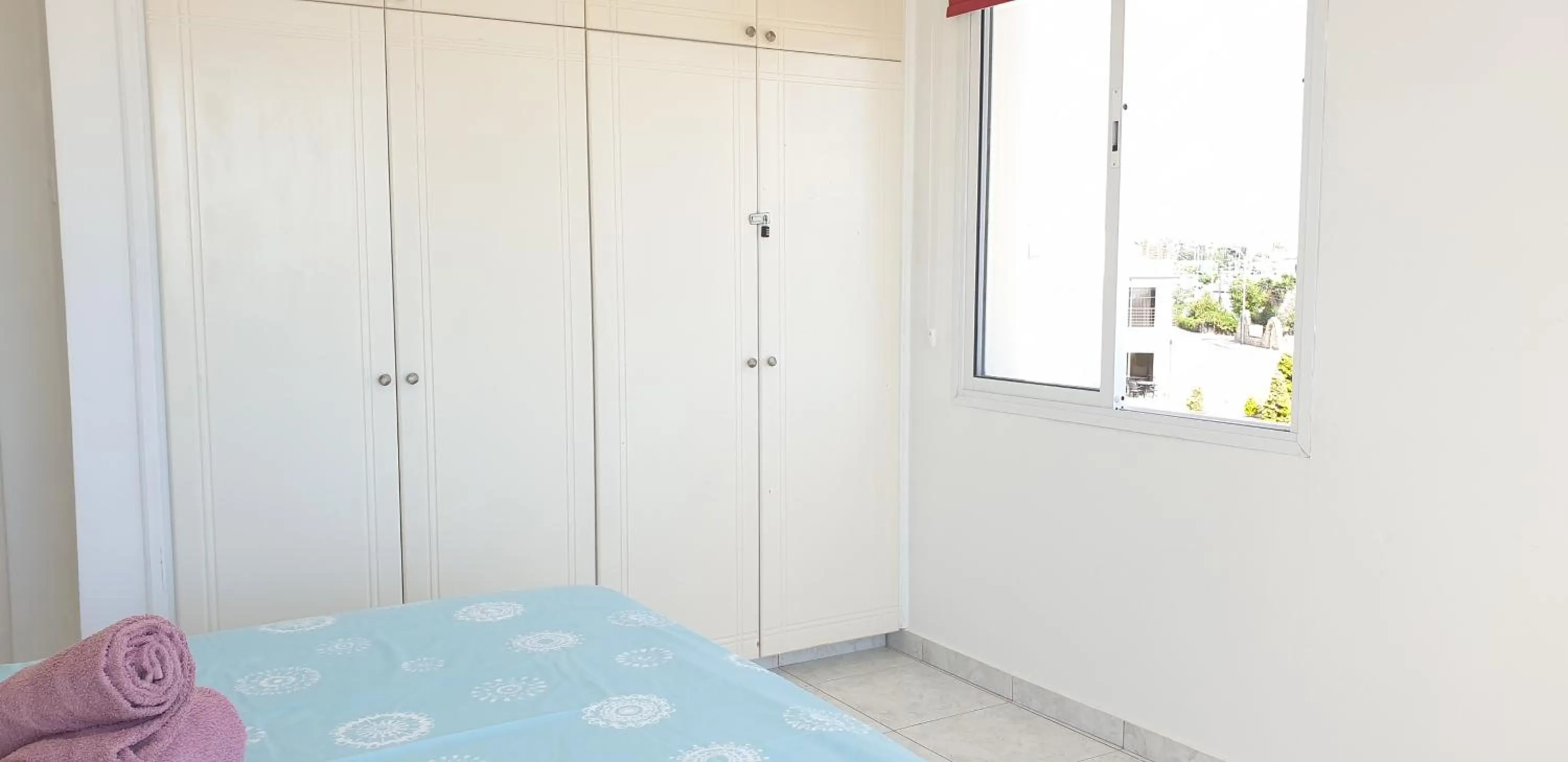 Bed in Athena and The Owl Beachside Apt