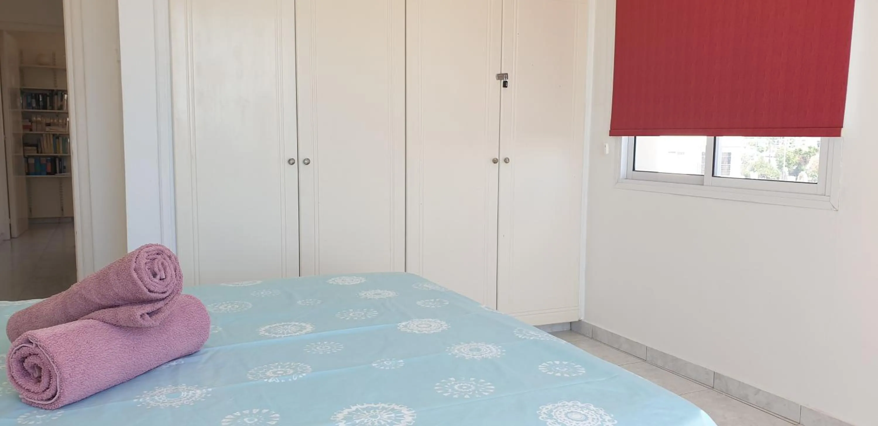 Bed in Athena and The Owl Beachside Apt