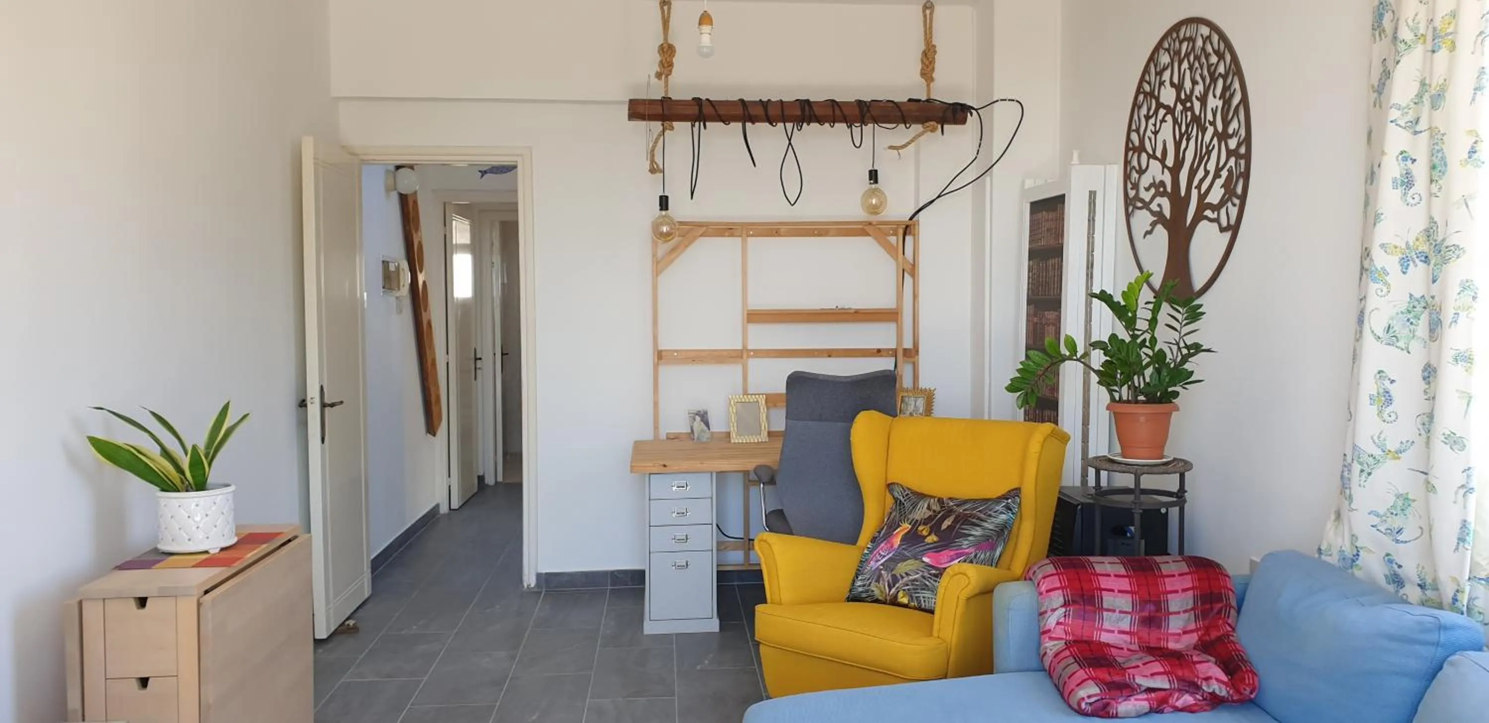 Seating area in Athena and The Owl Beachside Apt