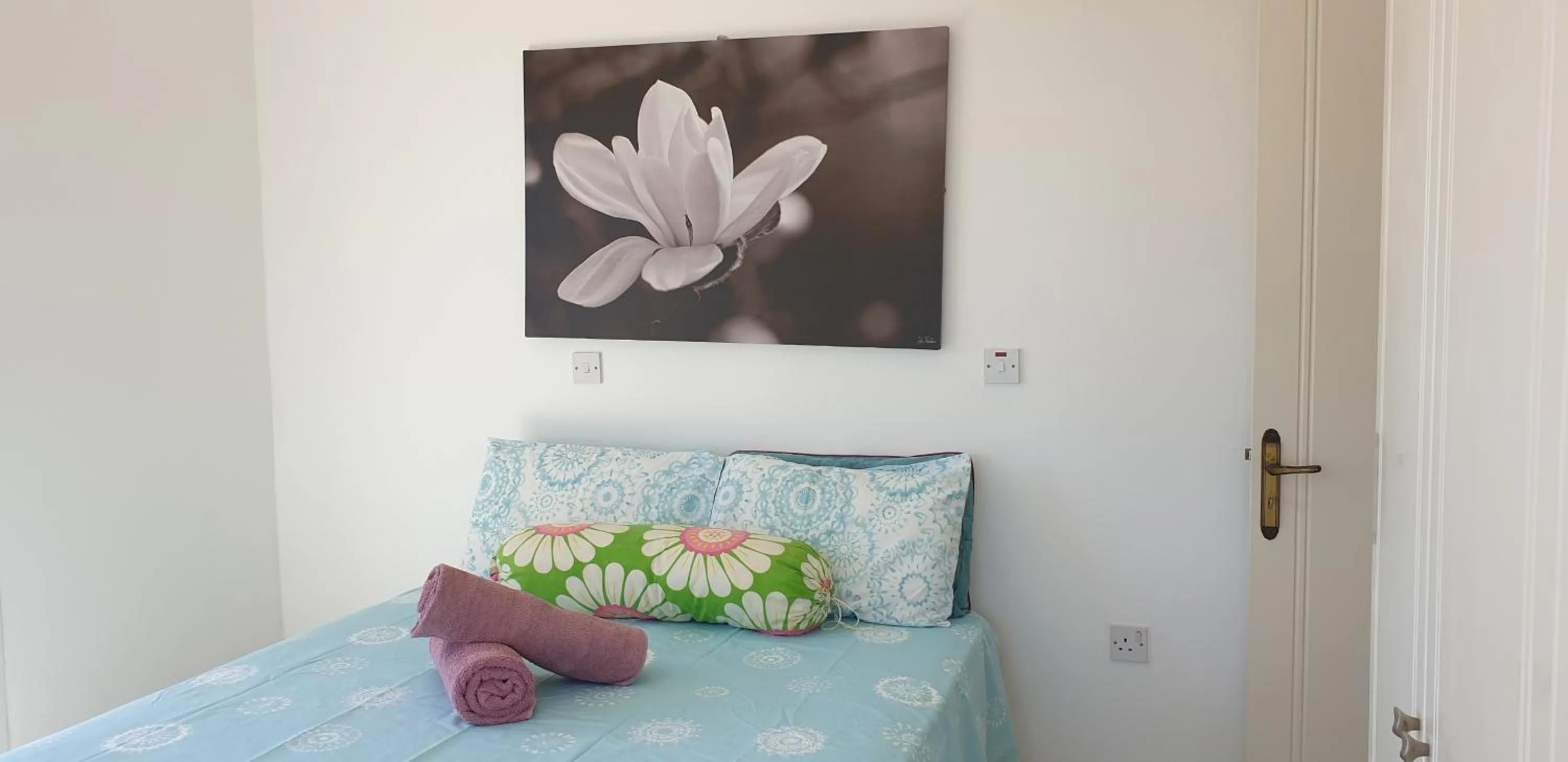 Bed in Athena and The Owl Beachside Apt