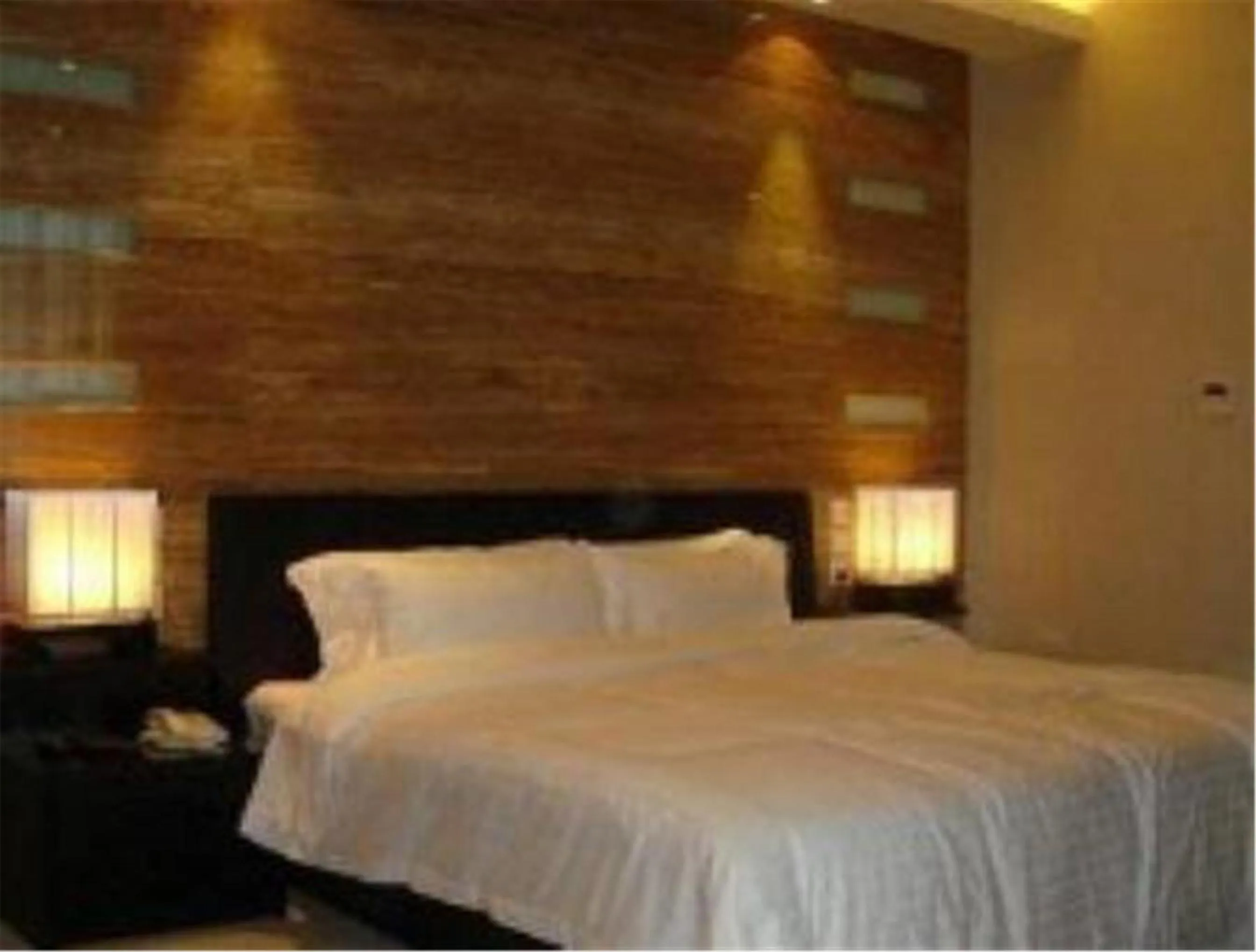 Bed in Hundred Centuries Hotel