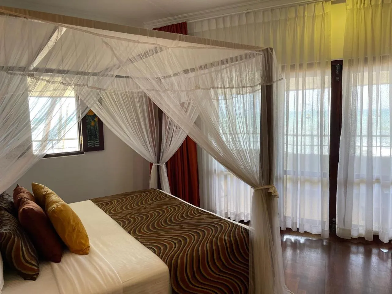 Bed in Tangerine Beach Hotel