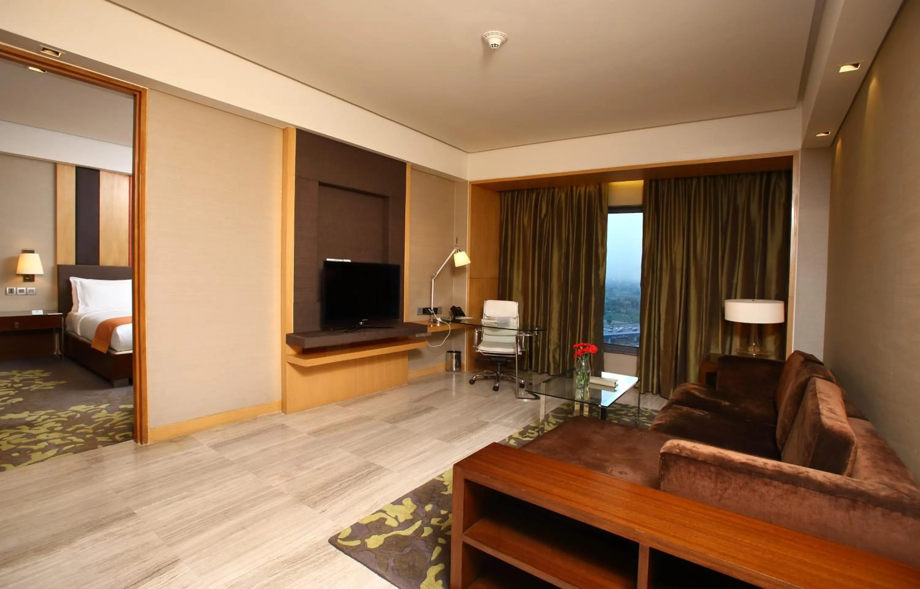 Living room, Bed in Holiday Inn New Delhi Mayur Vihar Noida by IHG