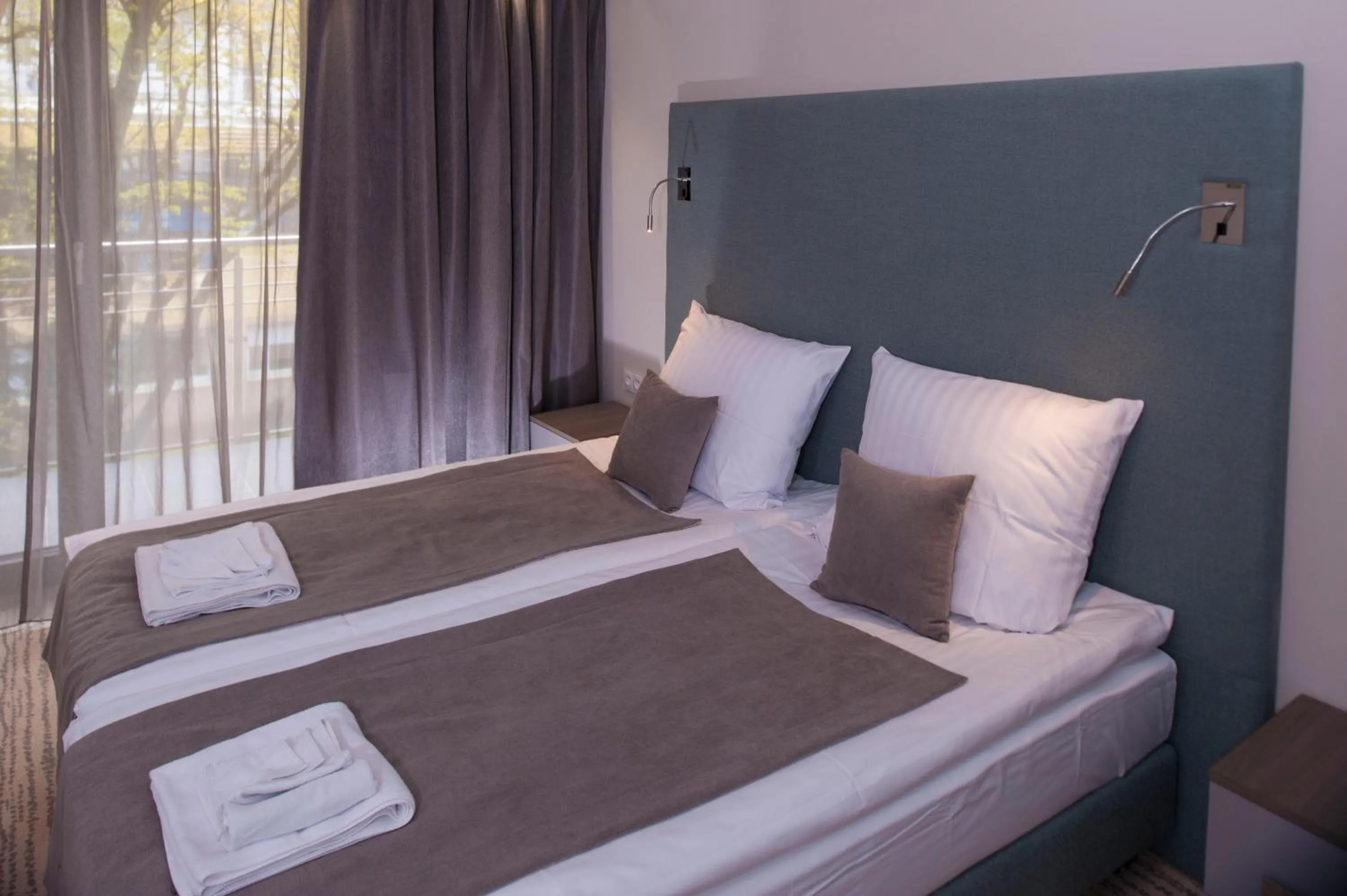 Bed in SeaPark Hotel Wellness & Spa