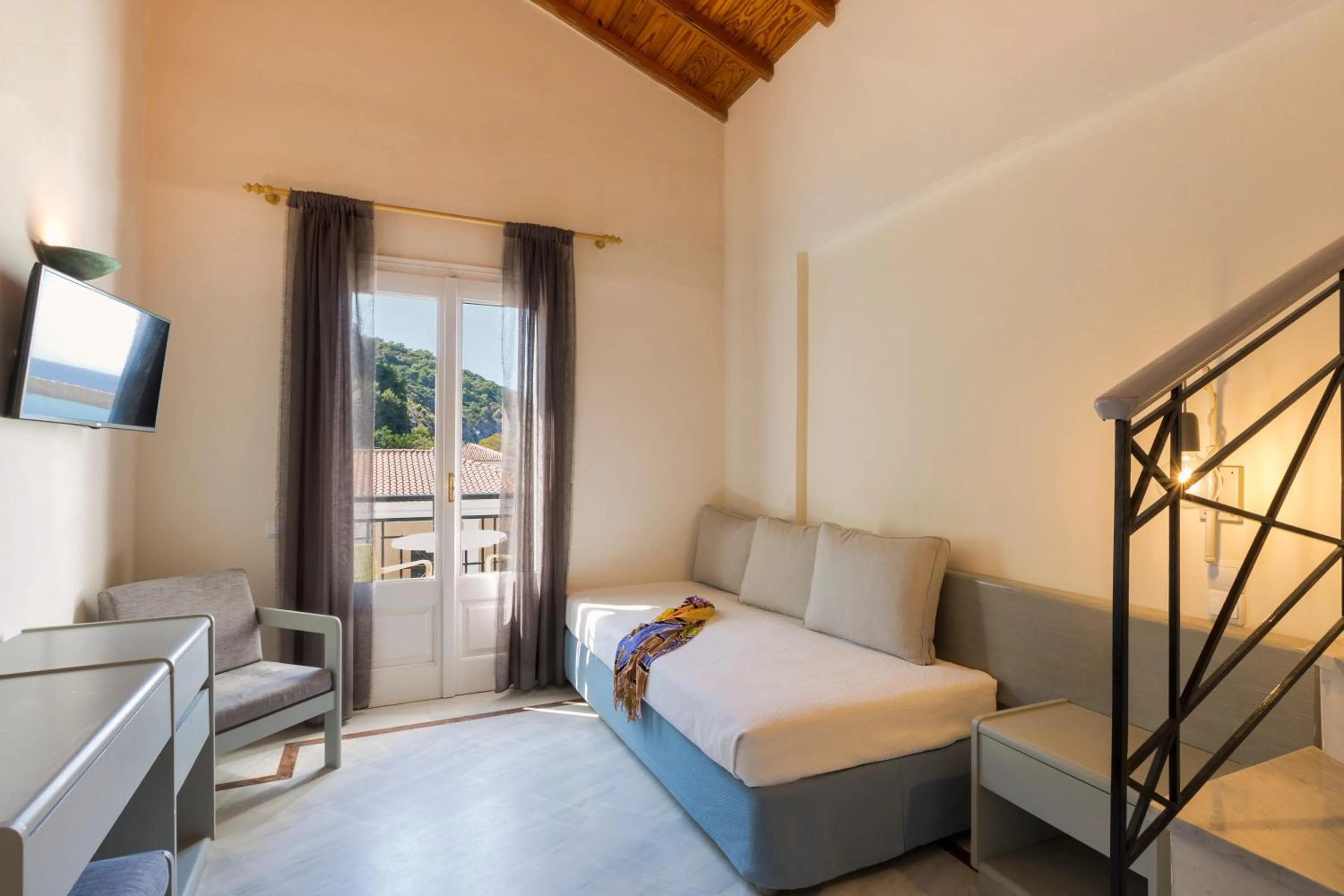 Seating area, Bed in Samaina Port Hotel