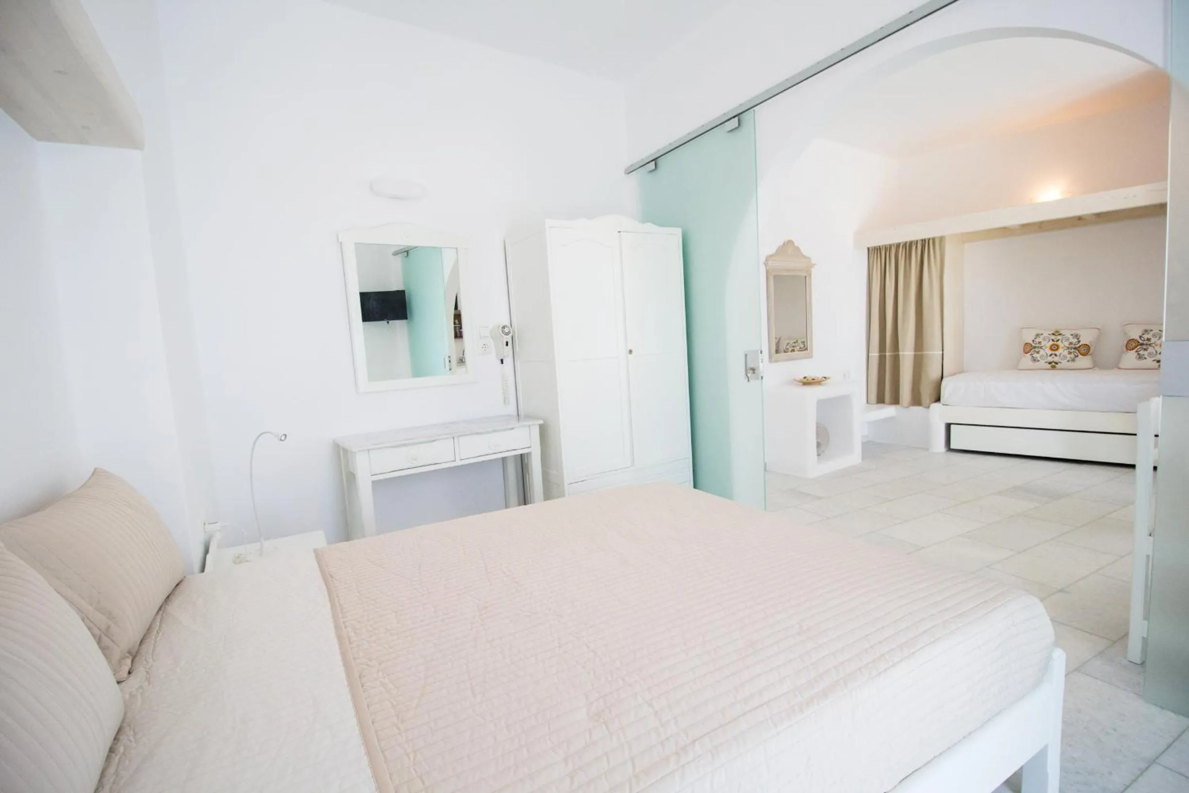 Bed in Aspasia Luxury Apartments