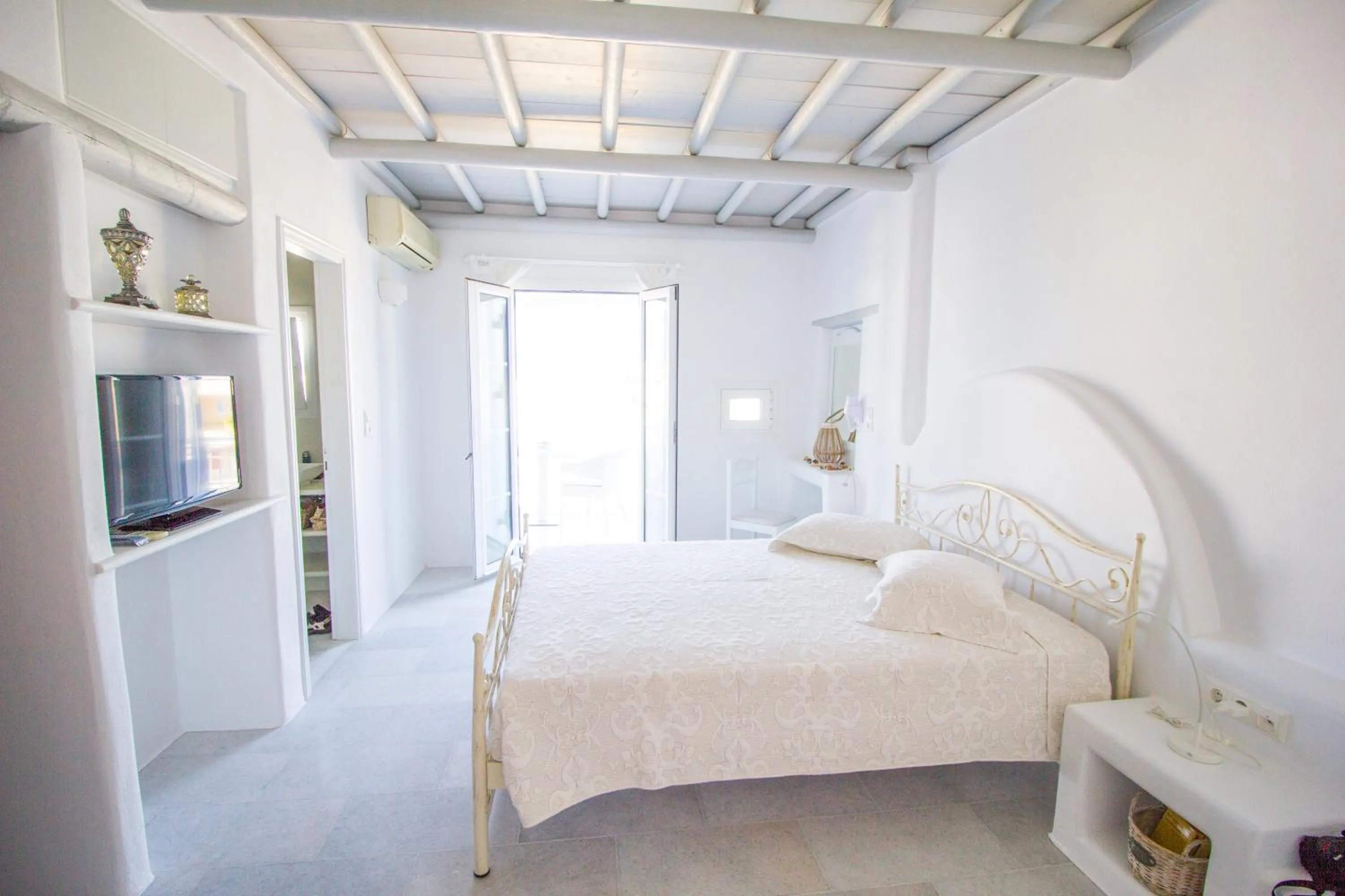 Bed in Aspasia Luxury Apartments