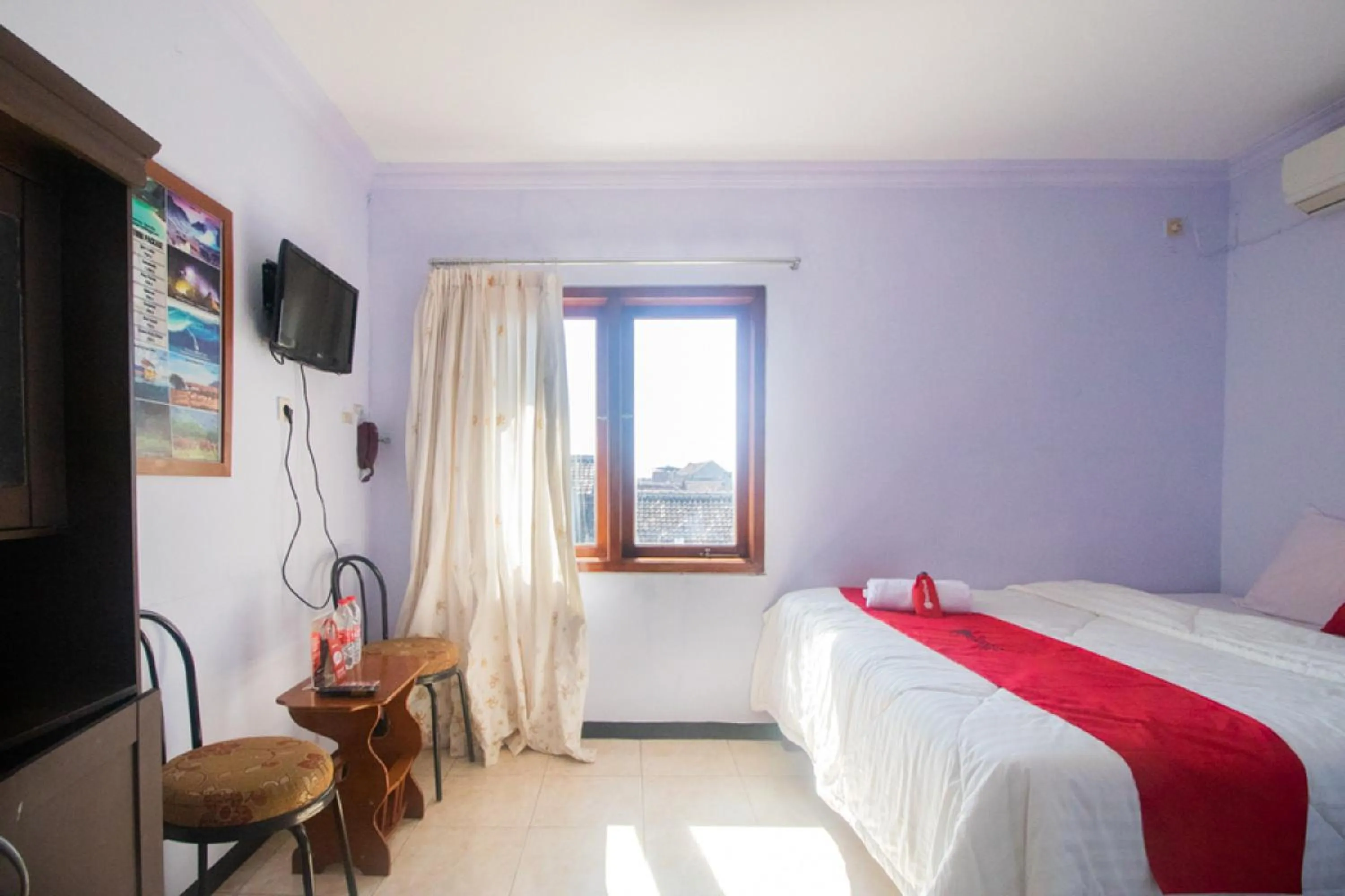 Bed in RedDoorz near Pantai Boom