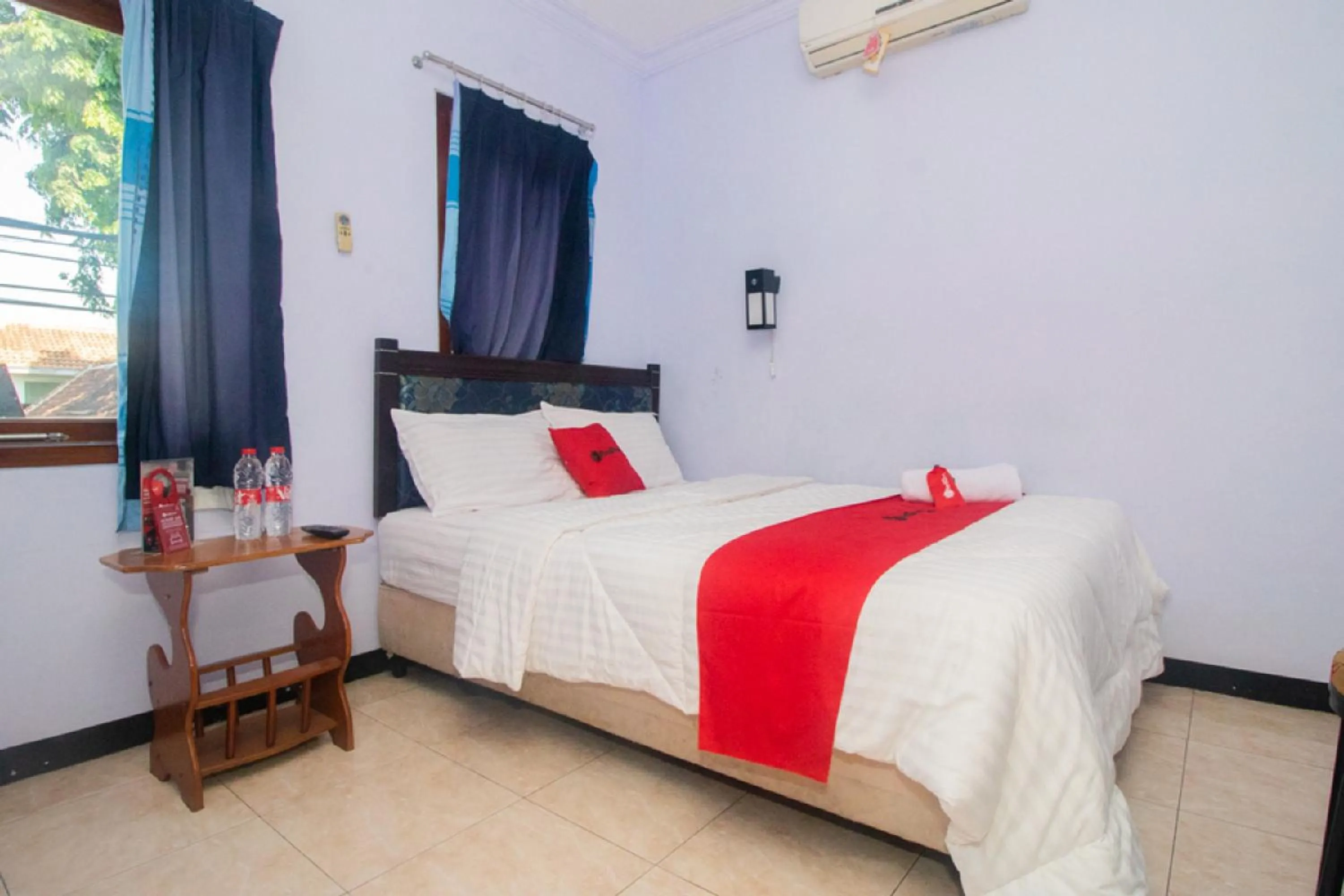 Bed in RedDoorz near Pantai Boom