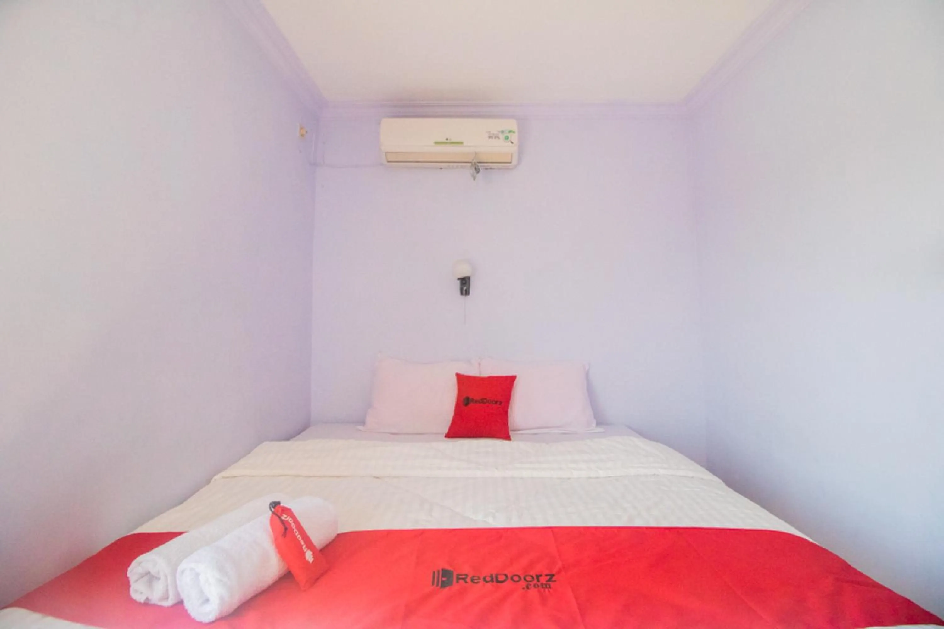 Bed in RedDoorz near Pantai Boom
