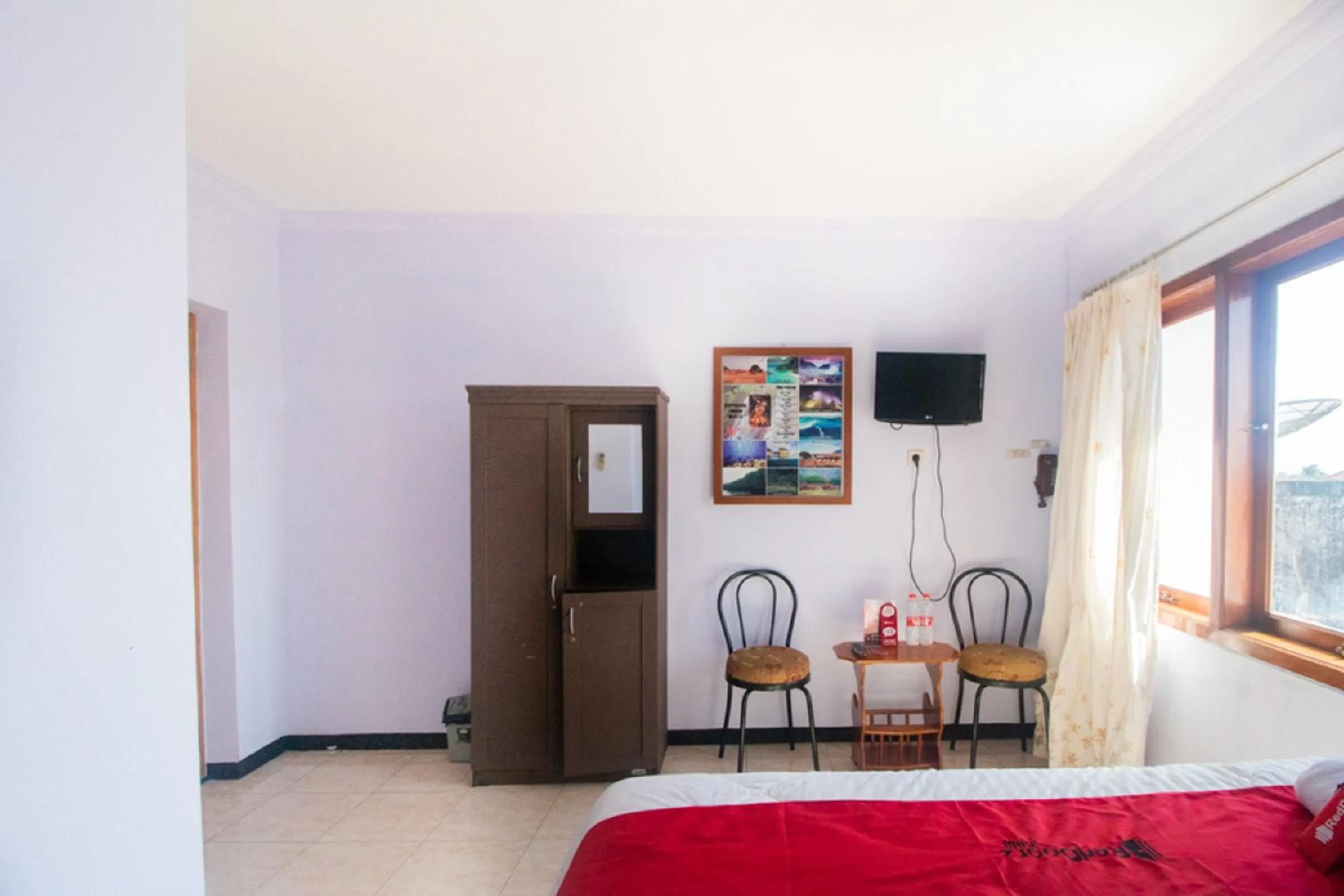 Bed in RedDoorz near Pantai Boom