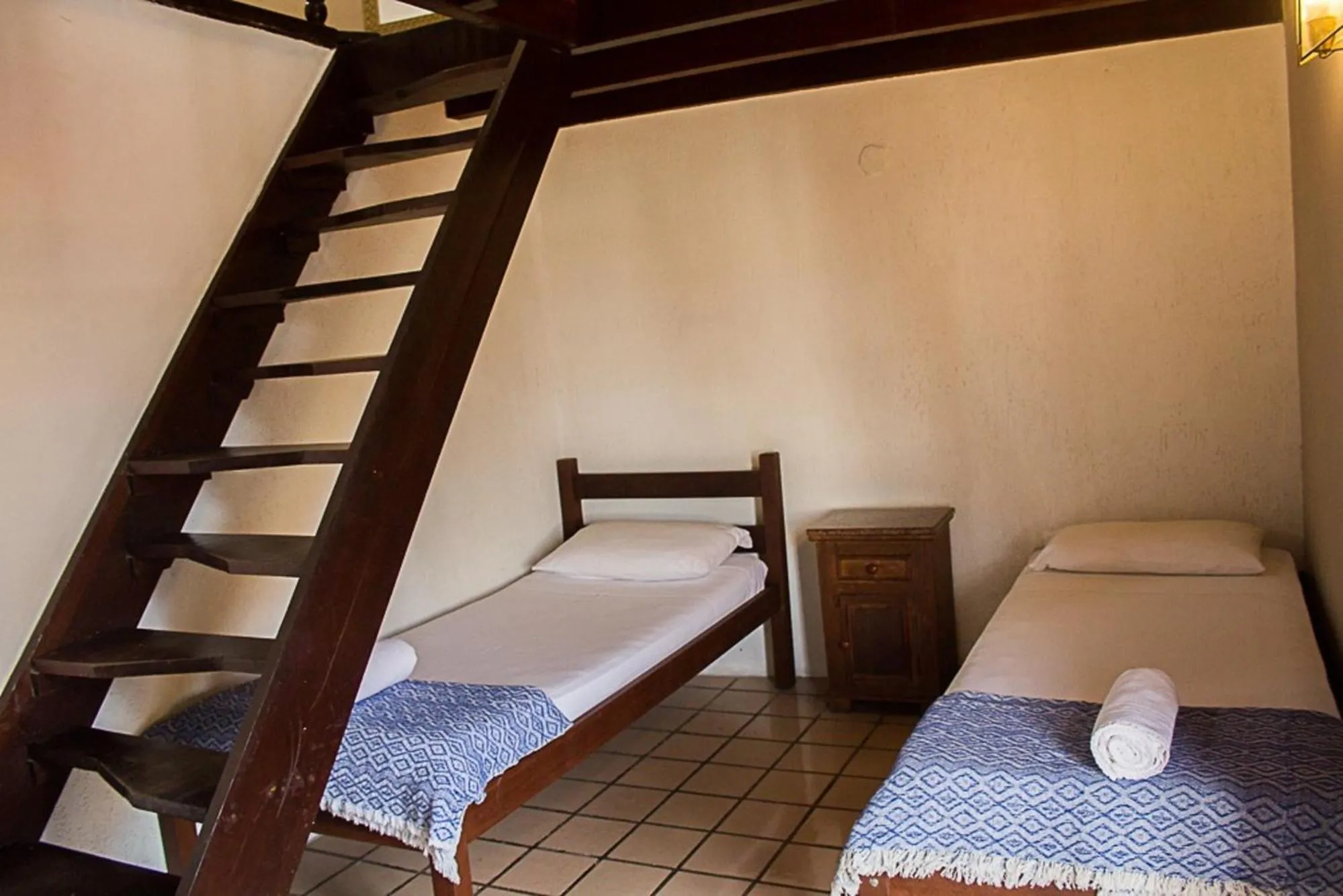 Bed in Pousada Casa da Pedra