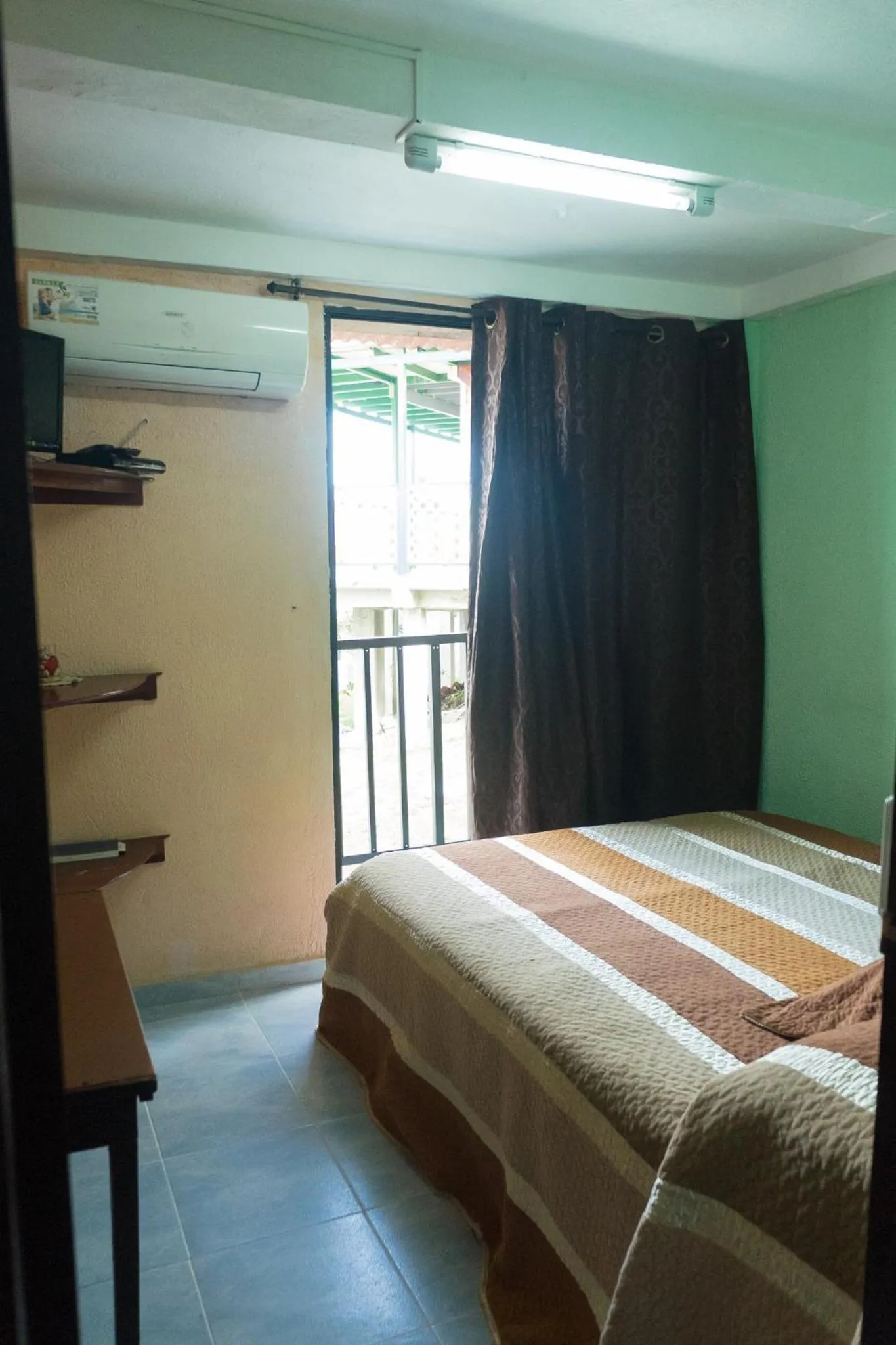 Bed in Posada Nativa Miss Trinie