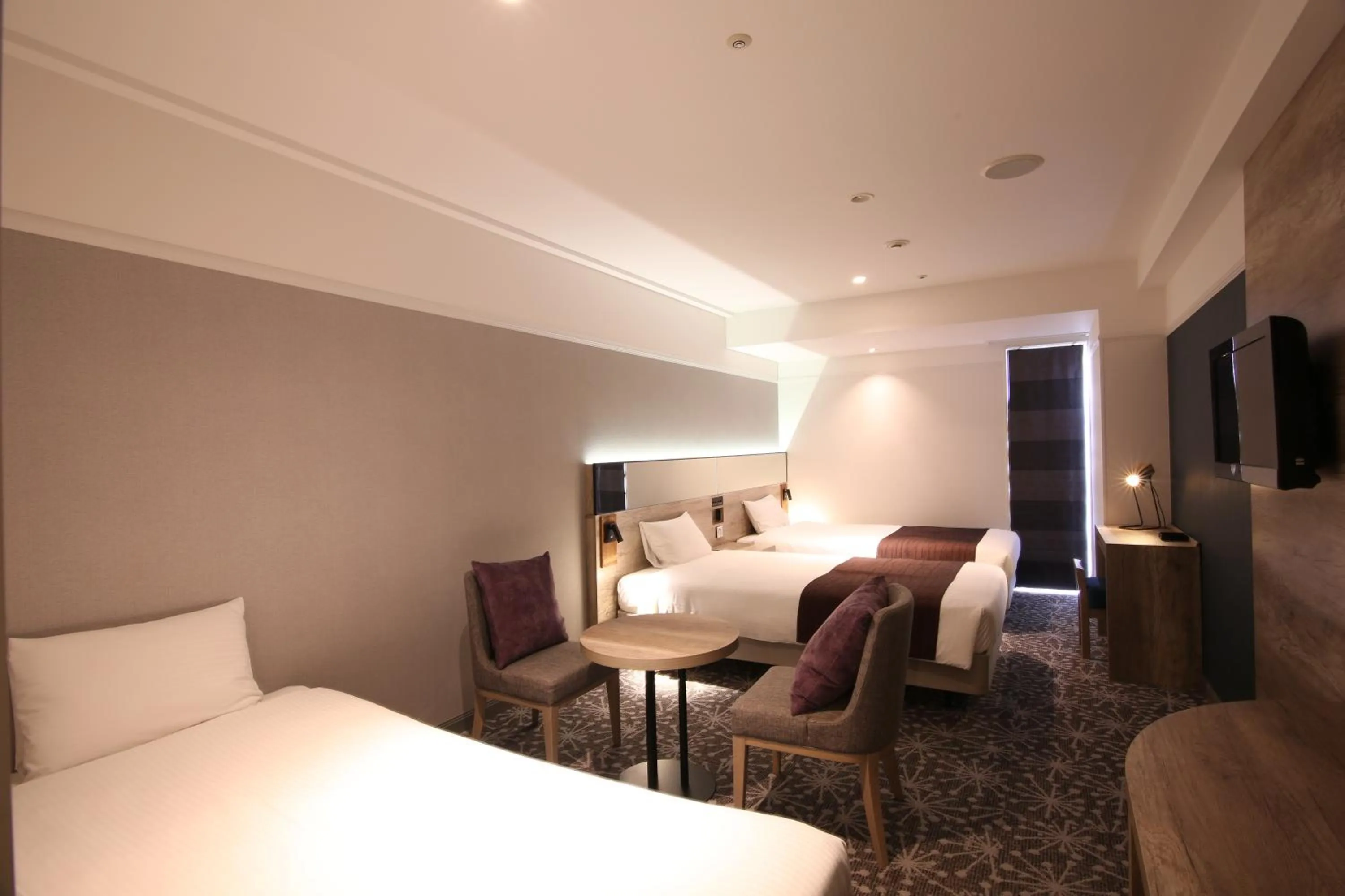 Photo of the whole room, Bed in Quintessa Hotel Sapporo