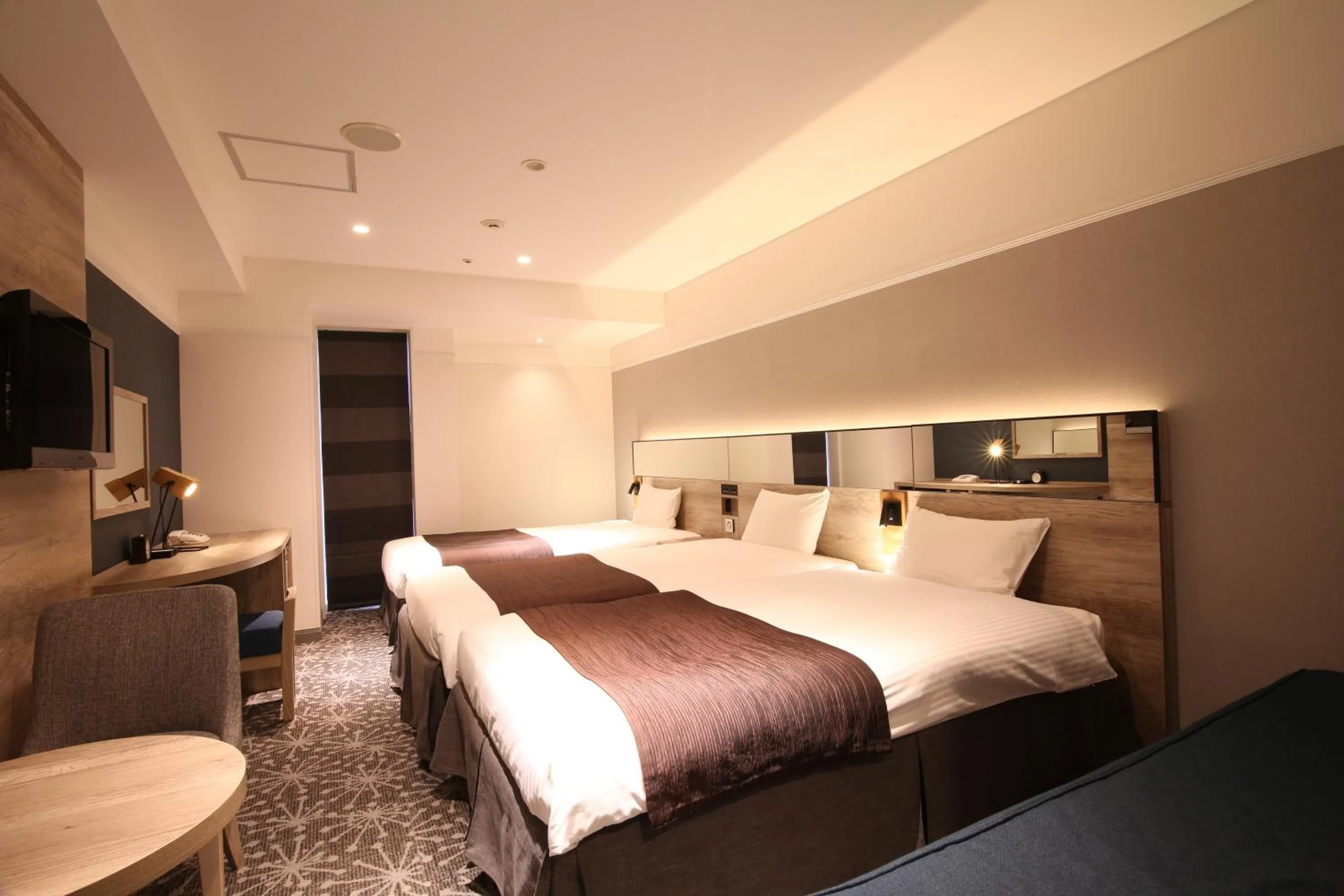 Photo of the whole room, Bed in Quintessa Hotel Sapporo