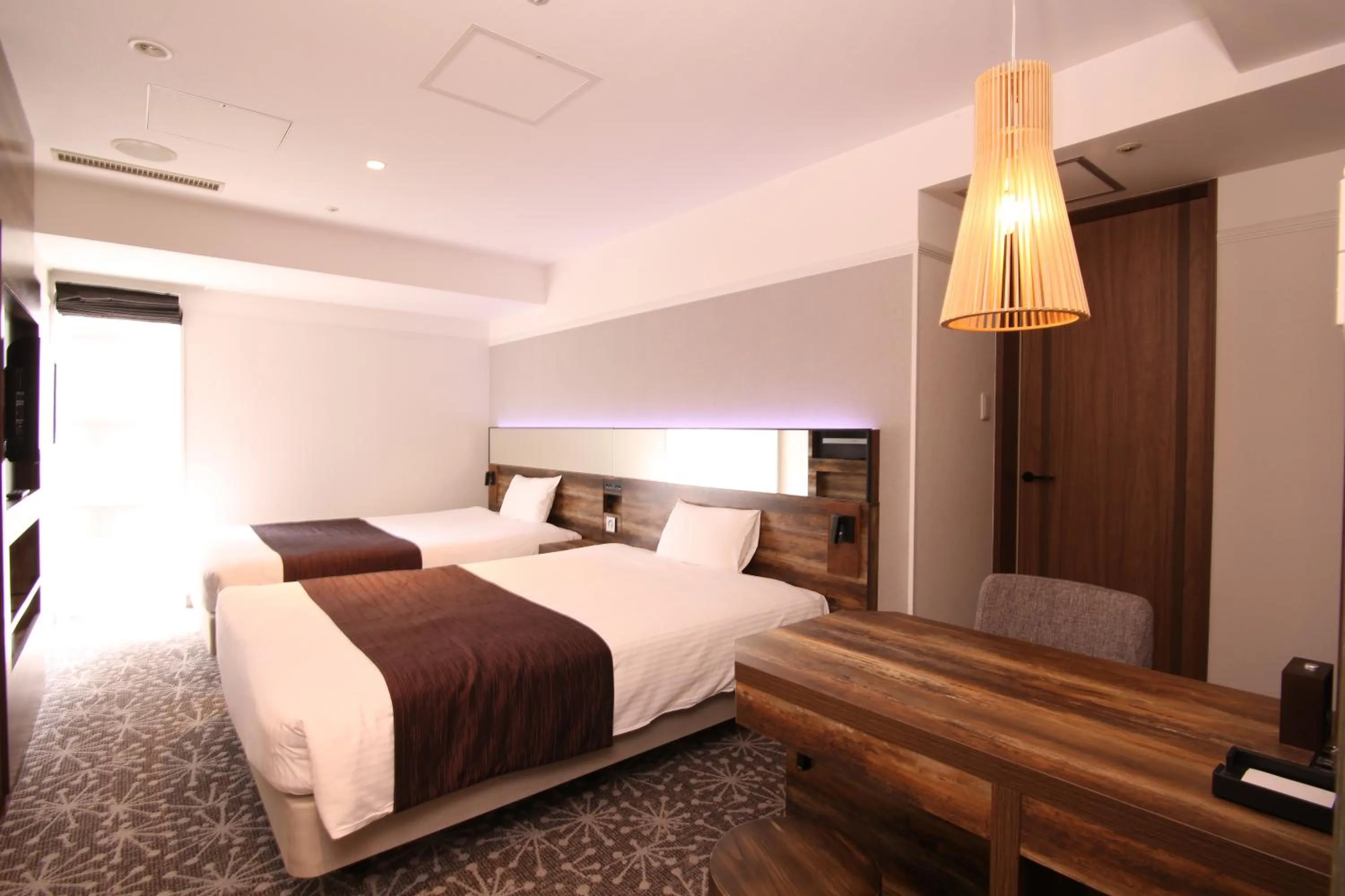 Photo of the whole room, Bed in Quintessa Hotel Sapporo