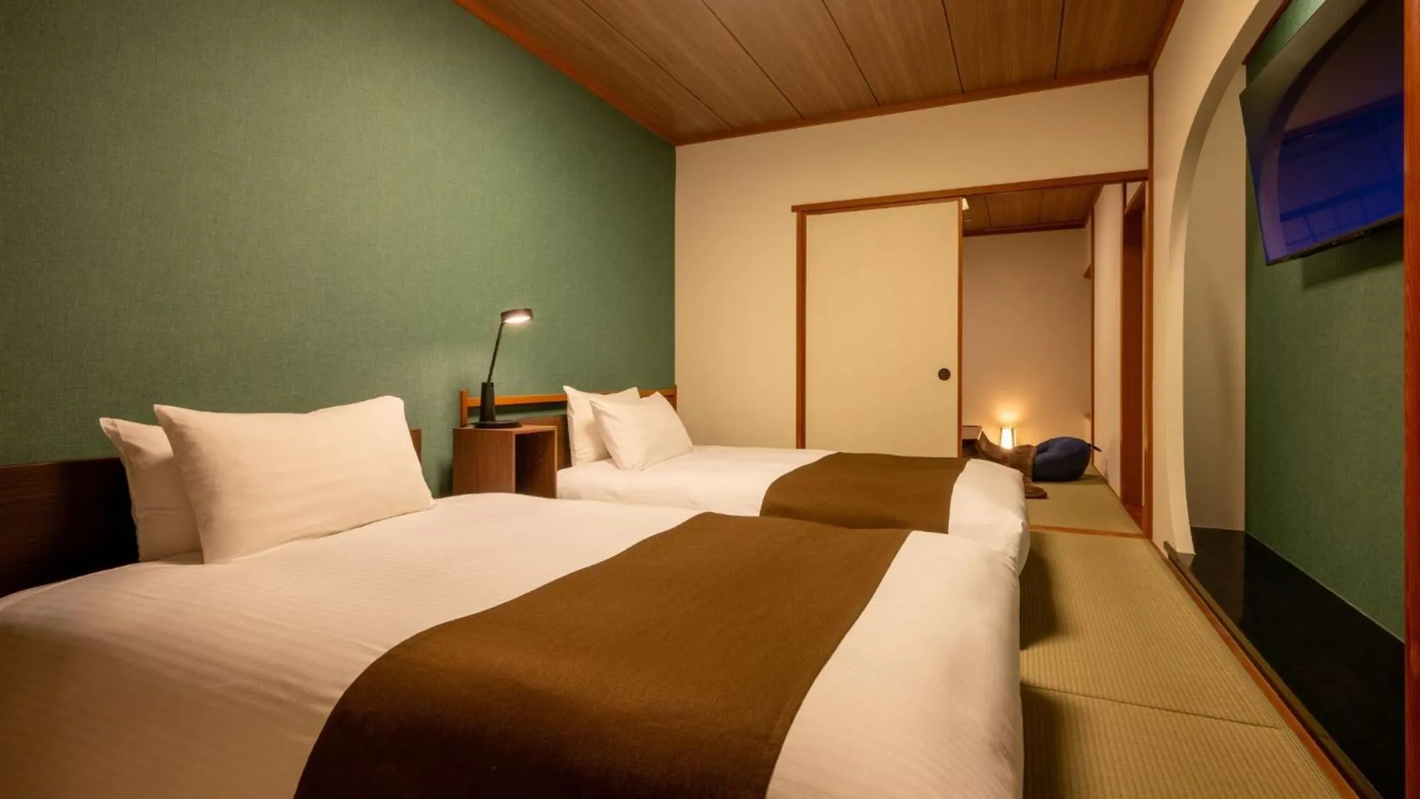 Bed in Marumine Kanko Hotel