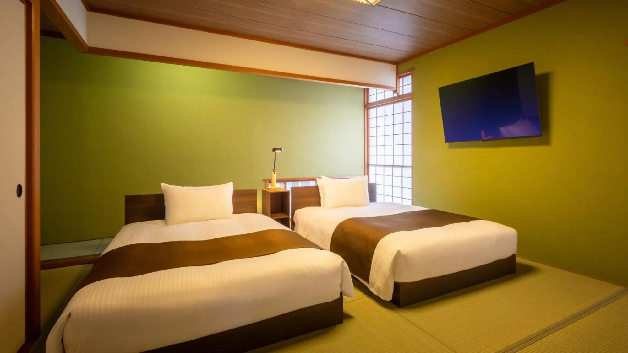 Bed in Marumine Kanko Hotel