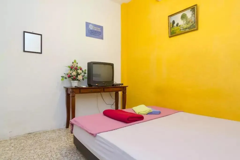 Bed in Cocoa Mews Cafe and Homestay