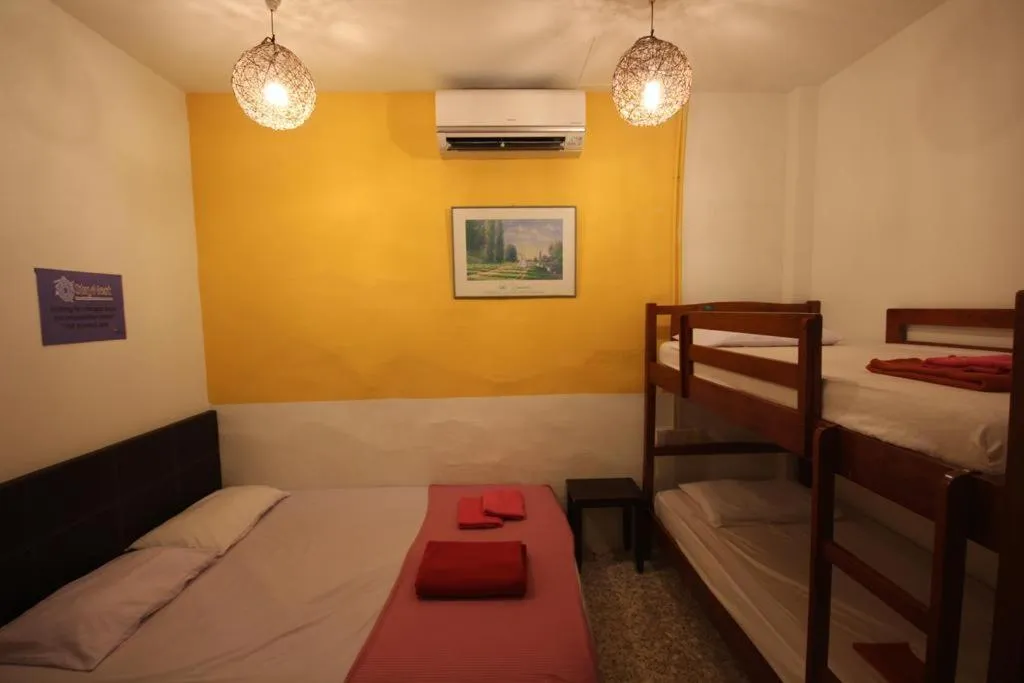 Bed in Cocoa Mews Cafe and Homestay