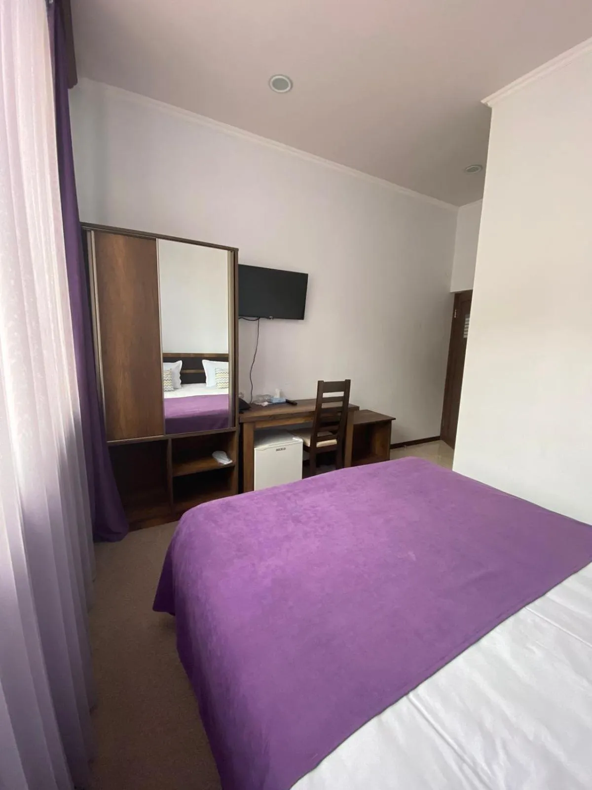 Communal lounge/ TV room, Bed in Mina Hotel