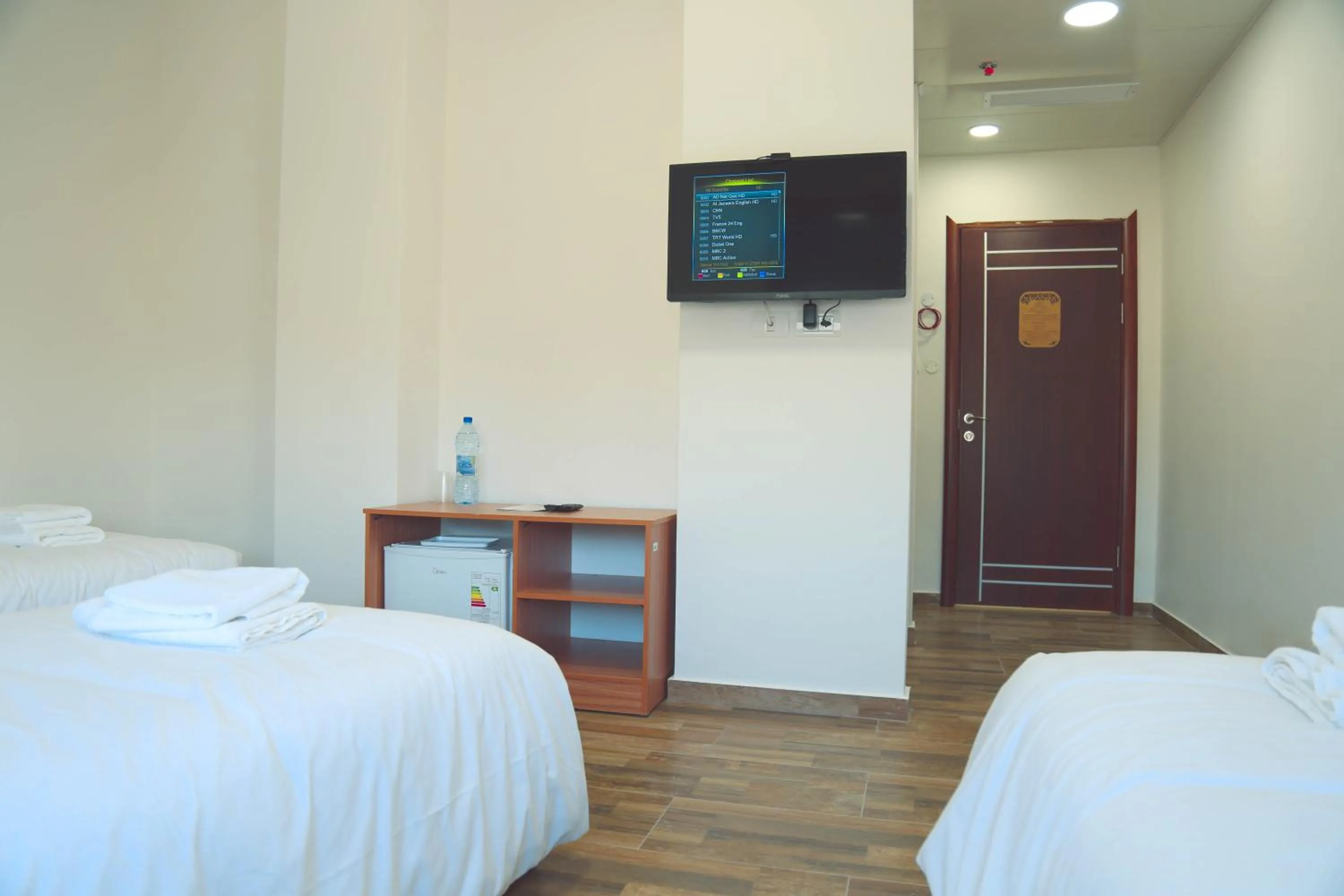 TV and multimedia, Bed in Alrowwad Guest House