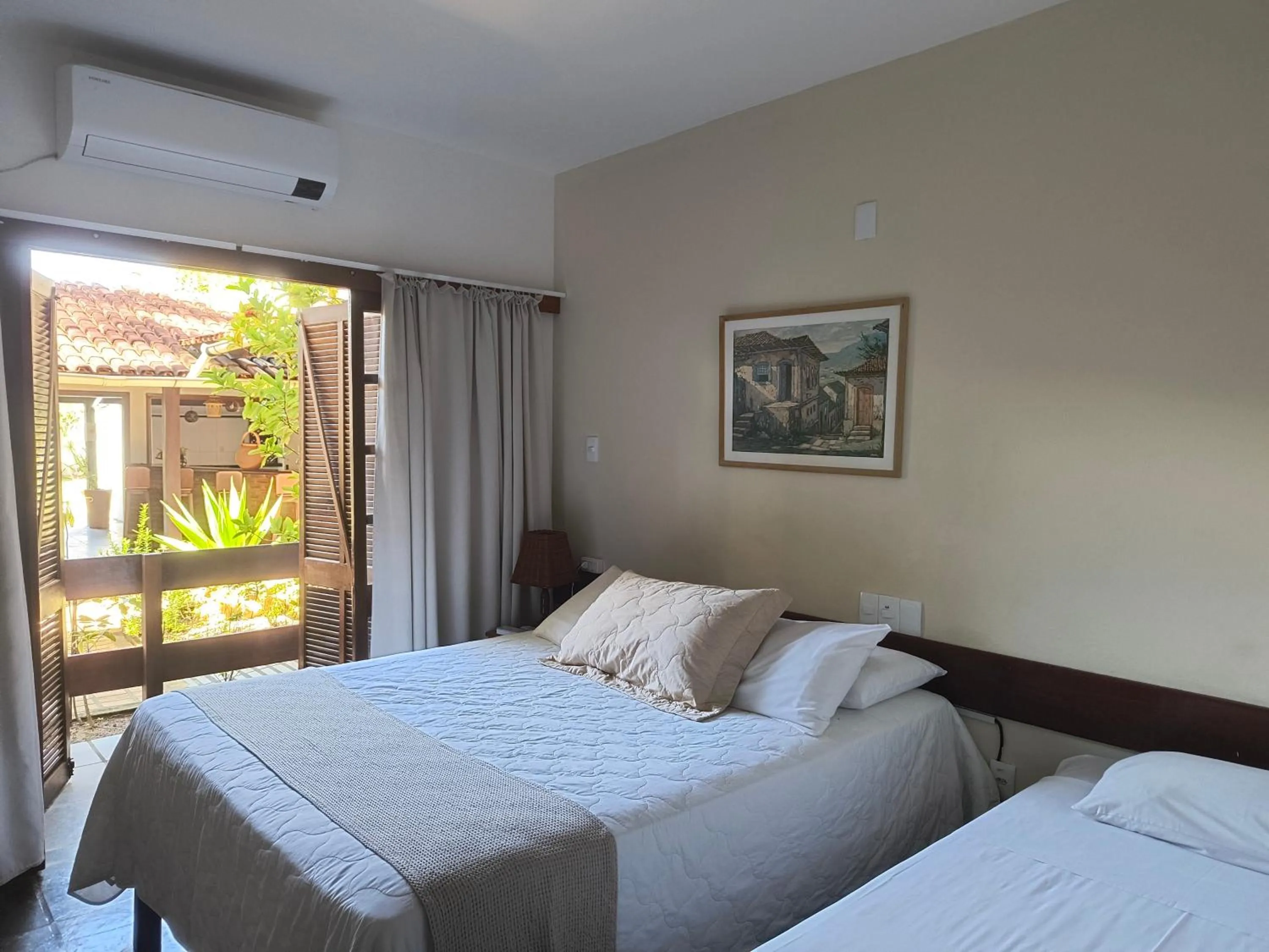 Bed in Pousada Guaratiba