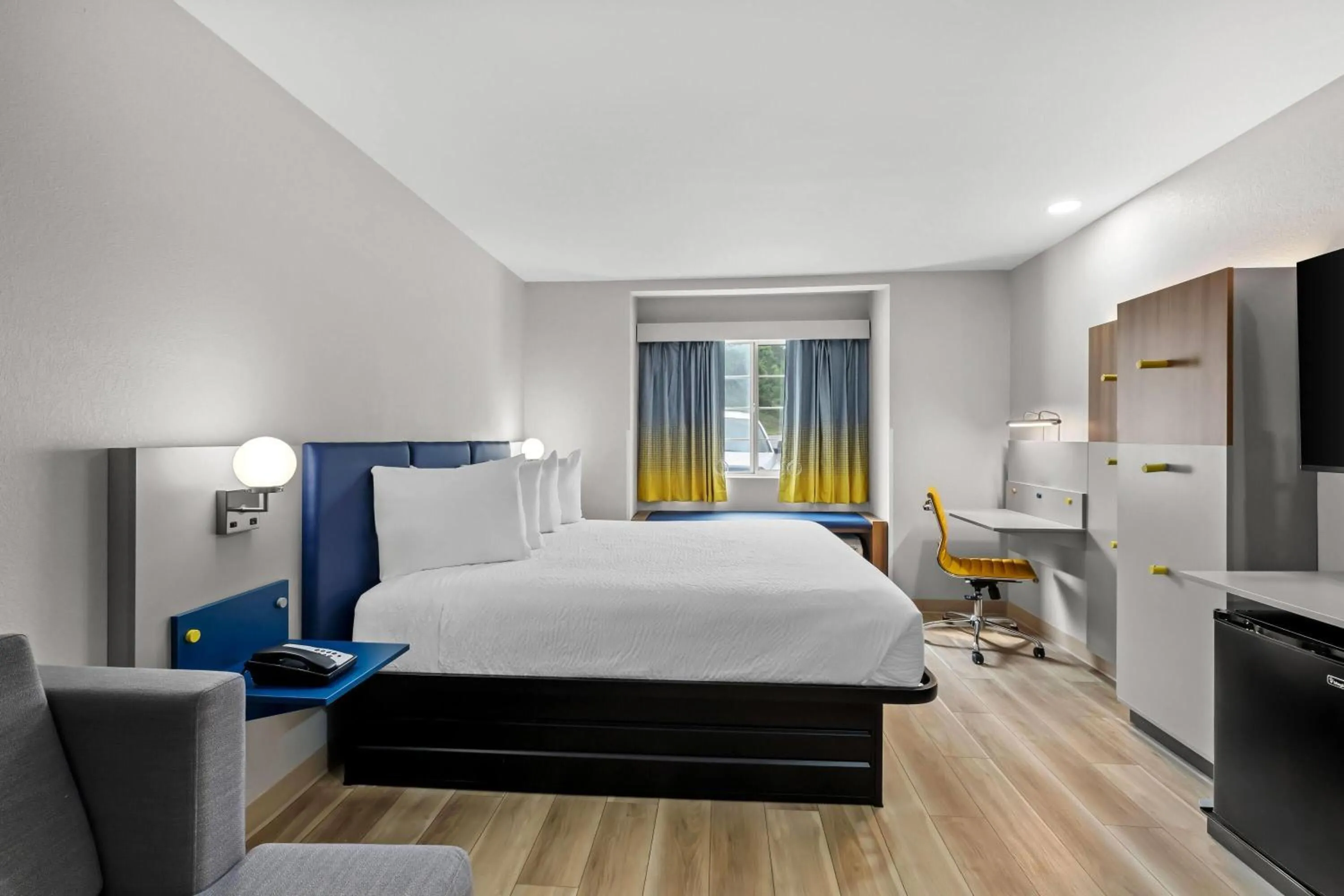 Bed in Microtel Inn & Suites by Wyndham Norcross