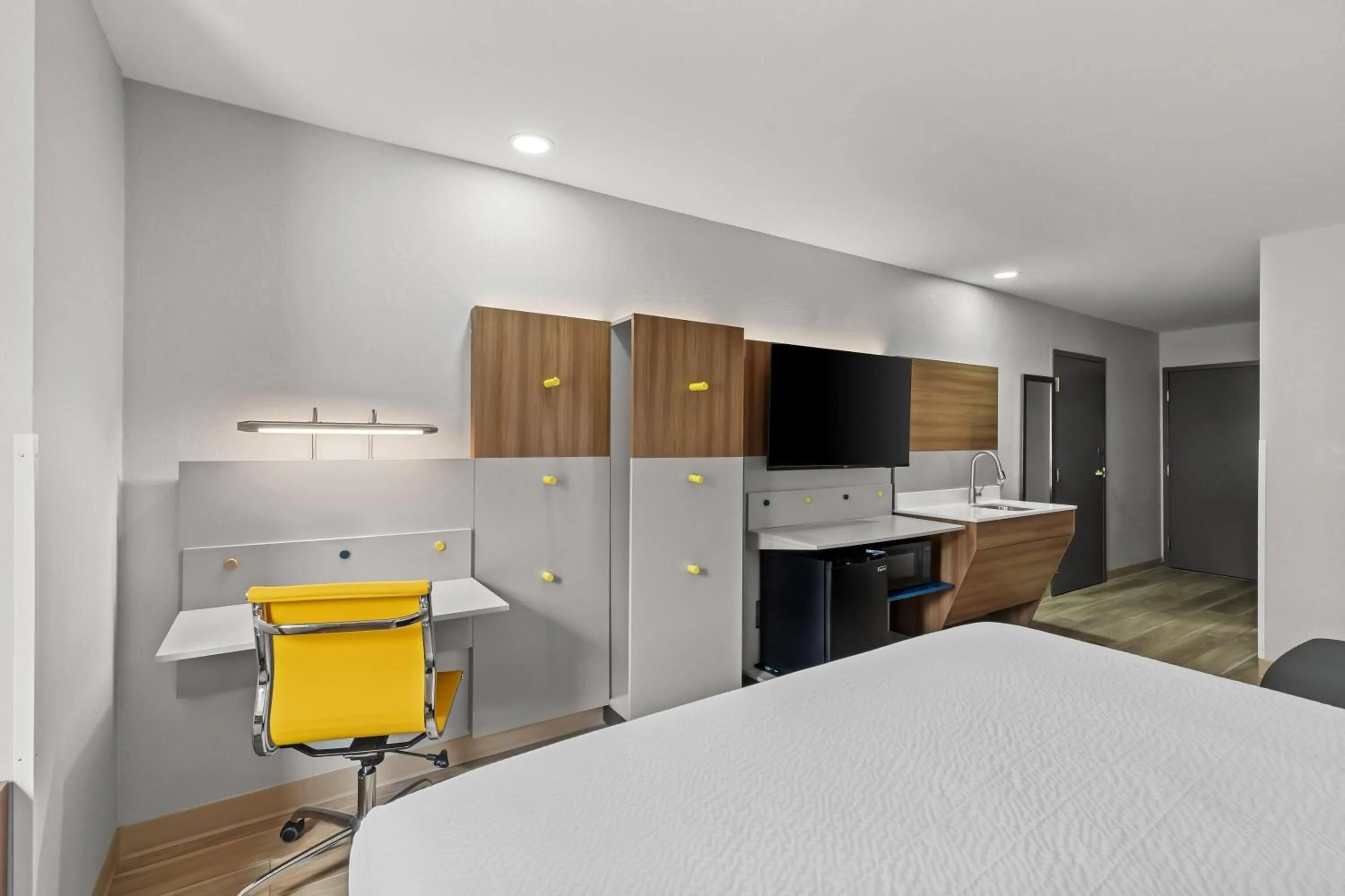 Bed in Microtel Inn & Suites by Wyndham Norcross