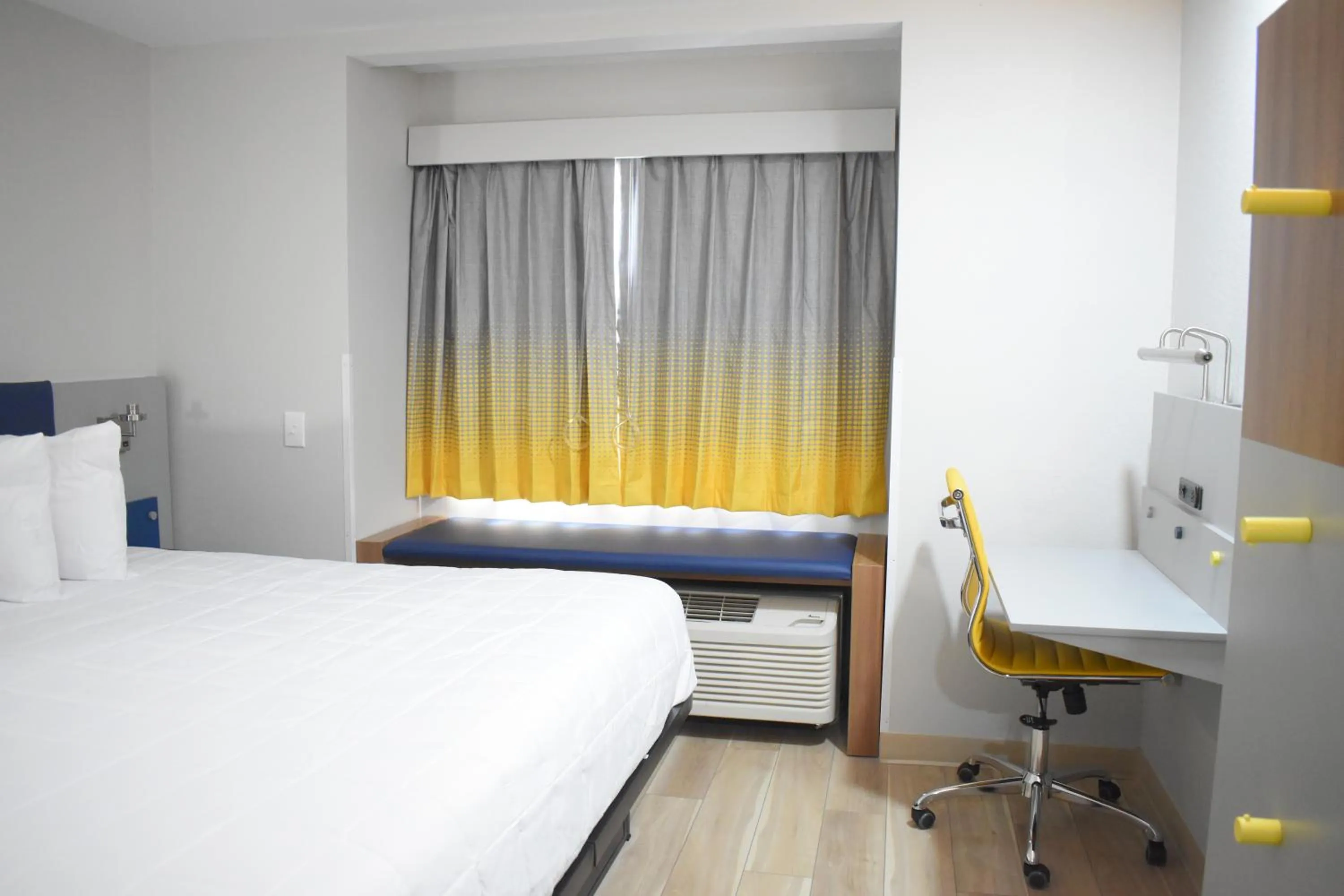 Bed in Microtel Inn & Suites by Wyndham Norcross