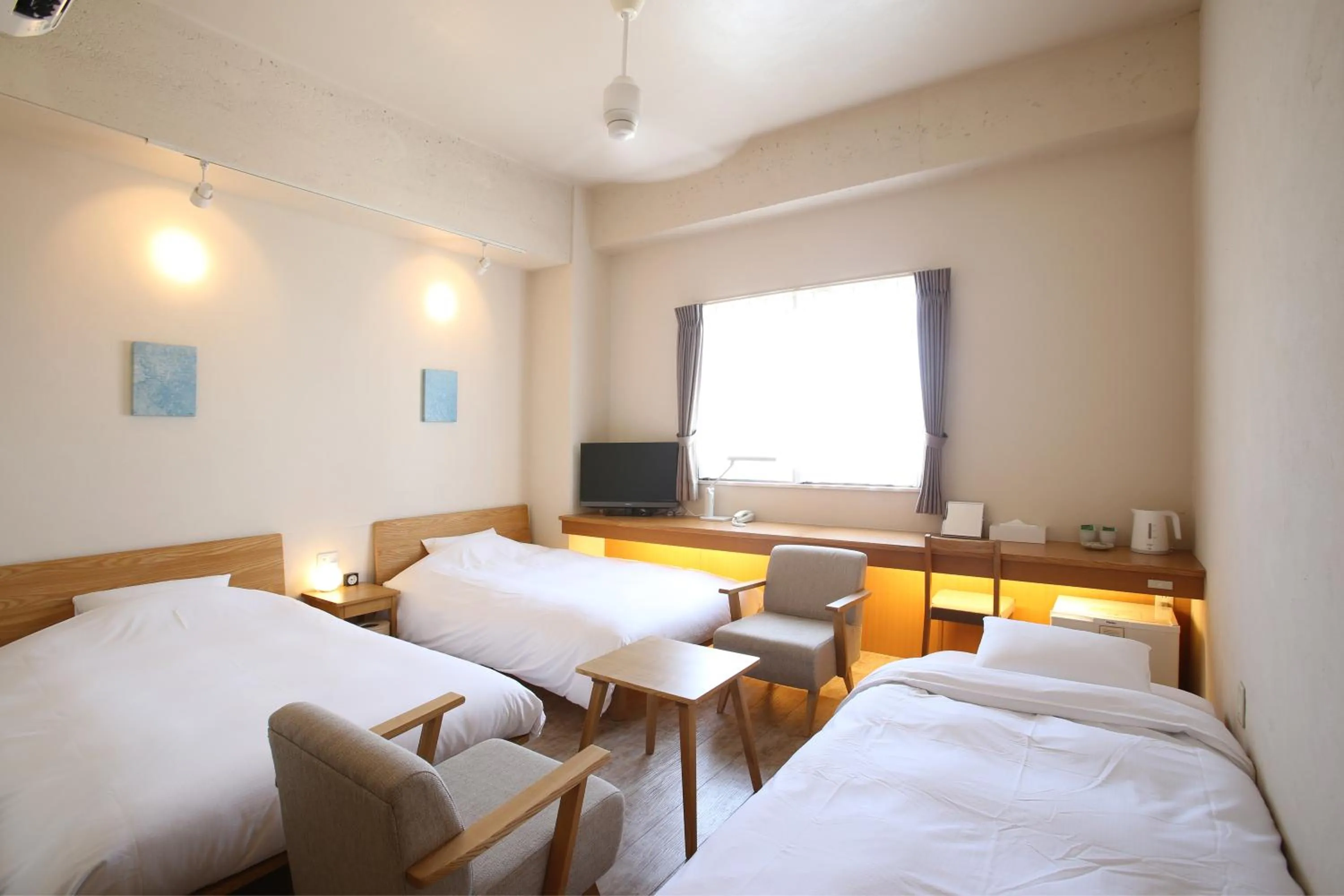 Photo of the whole room, Bed in Ishigakijima Hotel Cucule