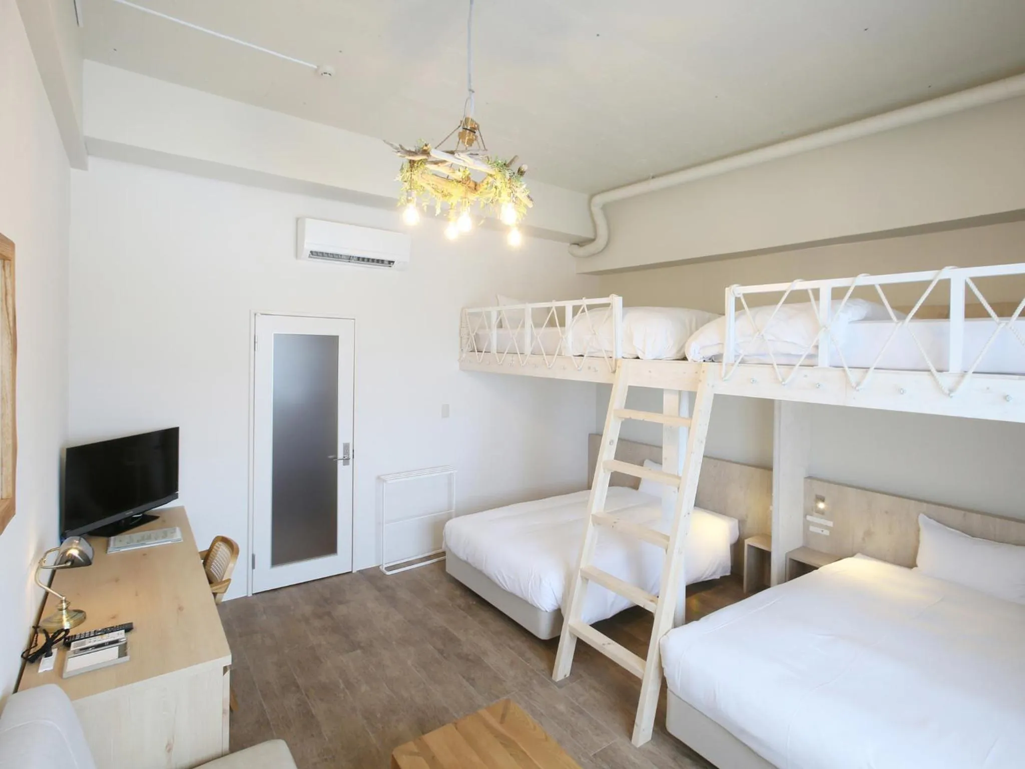 Photo of the whole room, Bed in Ishigakijima Hotel Cucule