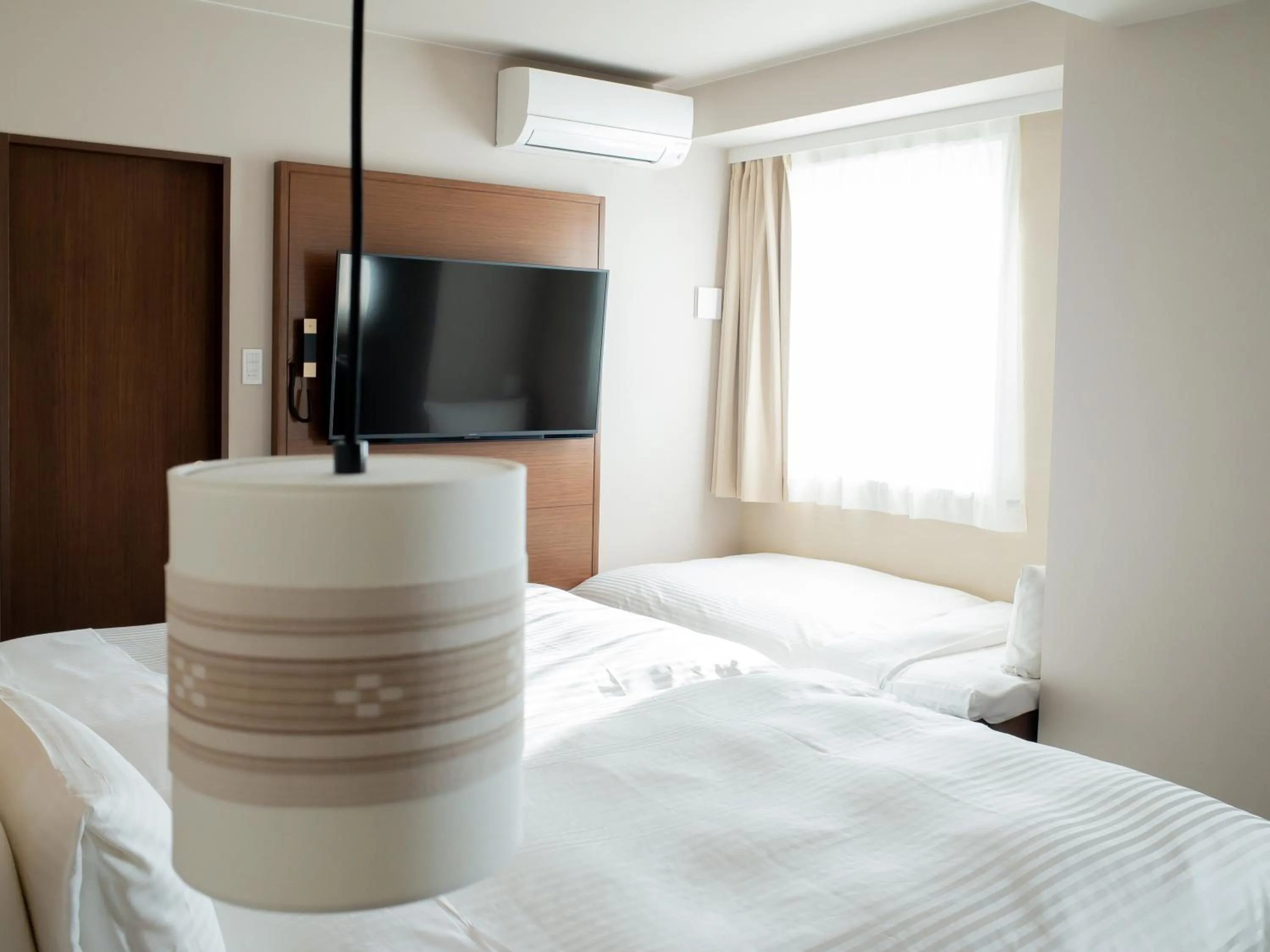 Bed in Hotel Palm Royal Resort Kokusai Street