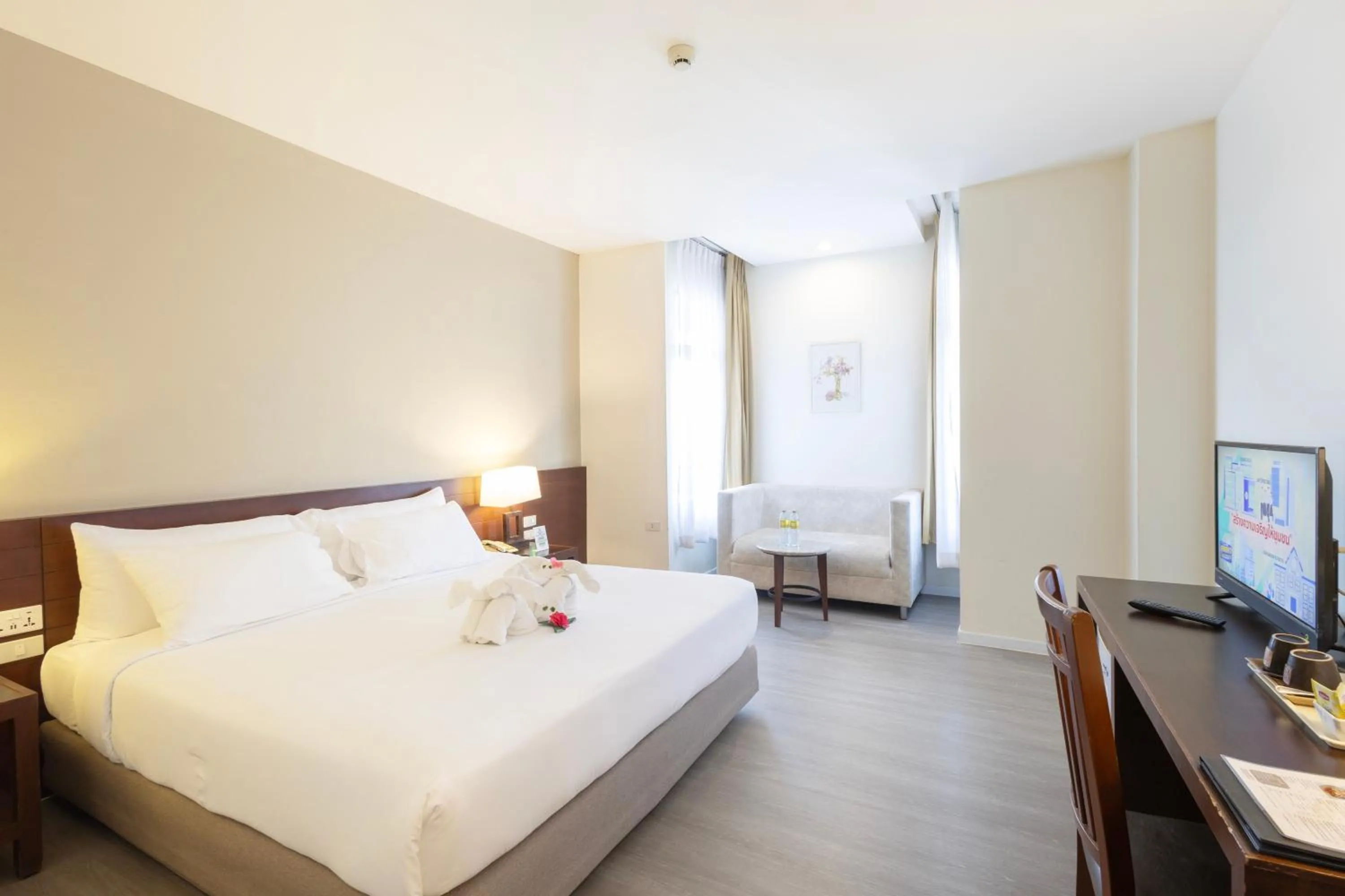 Bed in Golden Crown Grand Hotel