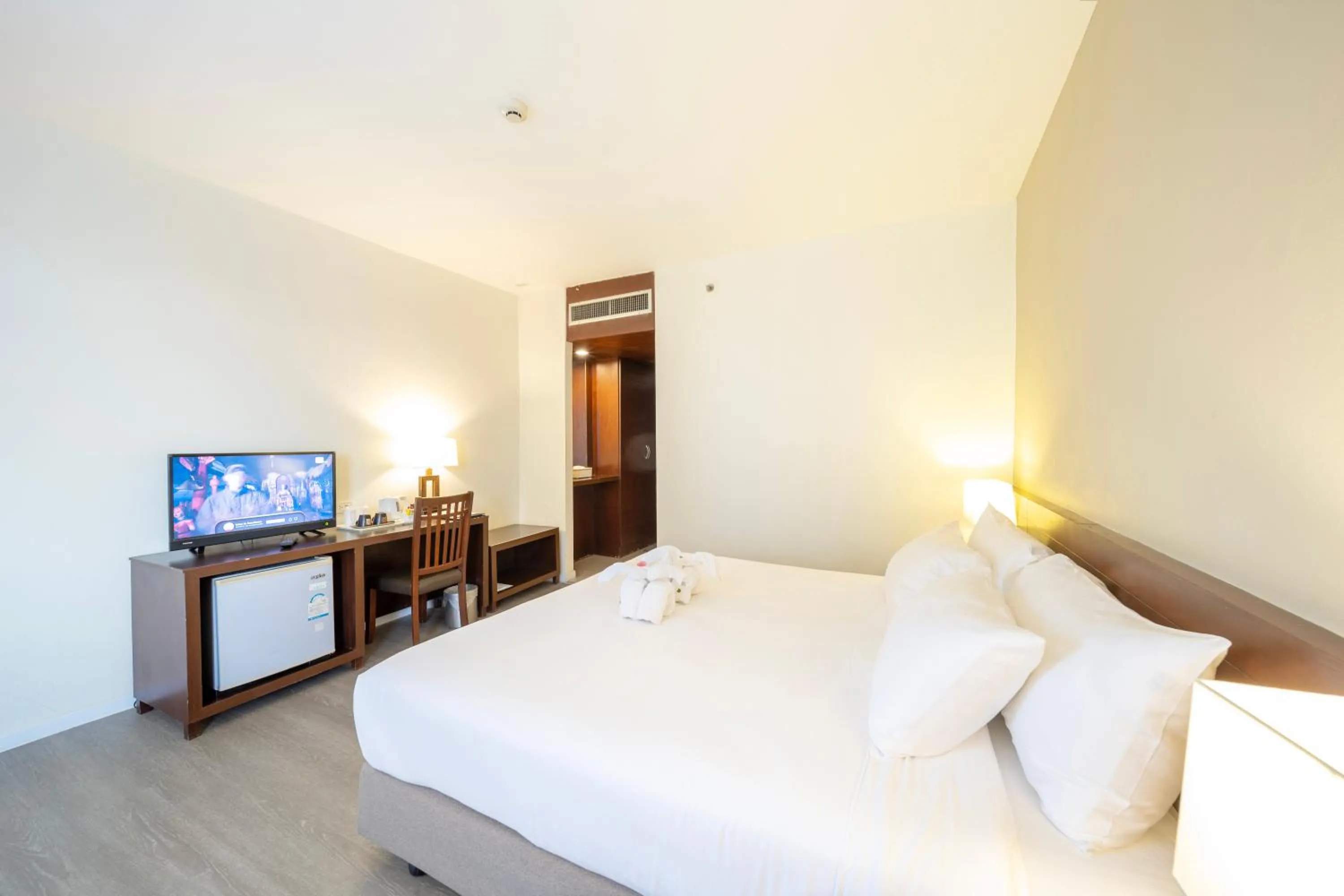 Bed in Golden Crown Grand Hotel