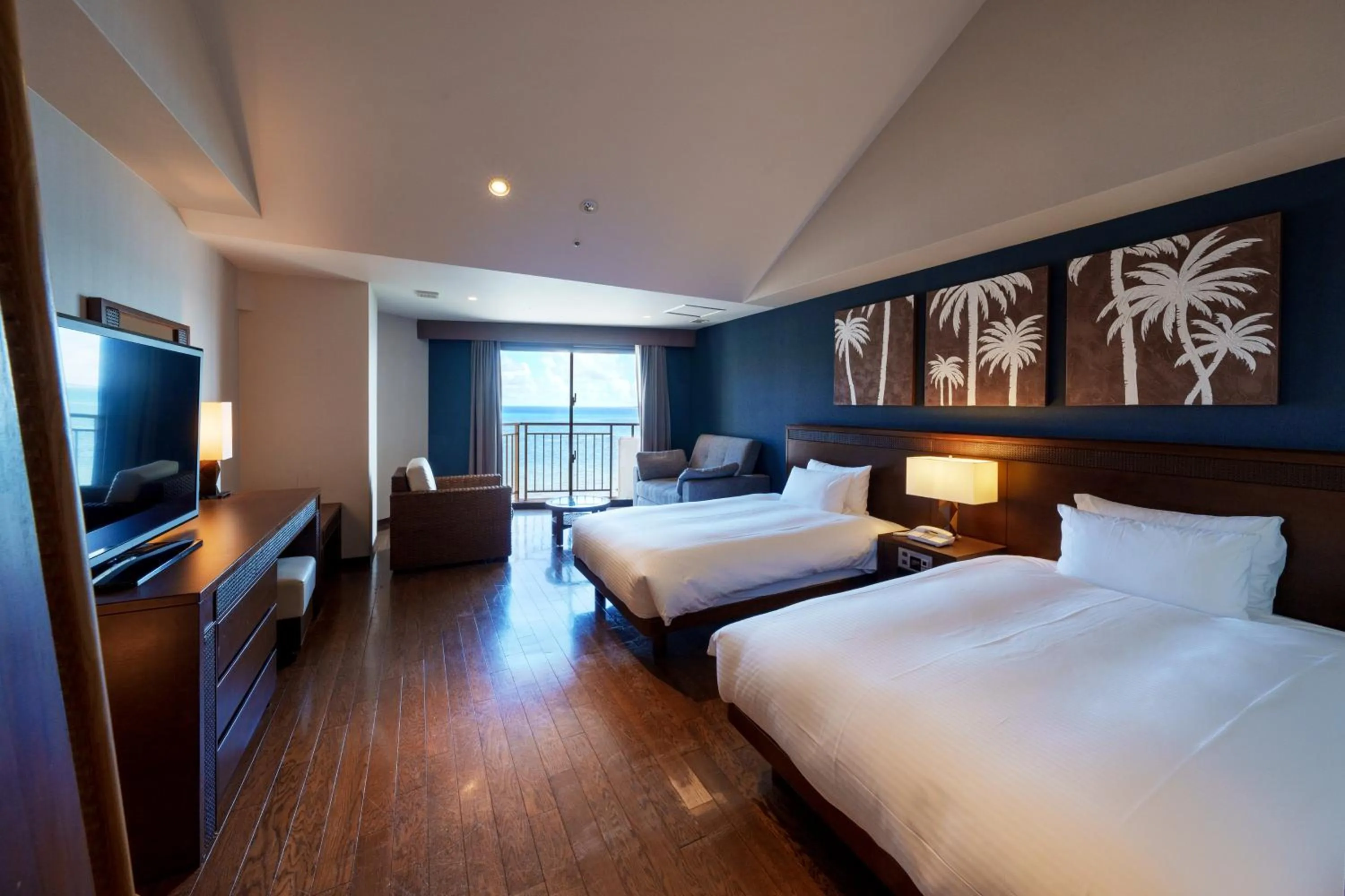 Bed in GRANDVRIORESORT ISHIGAKIJIMA Ocean's Wing & Villa Garden