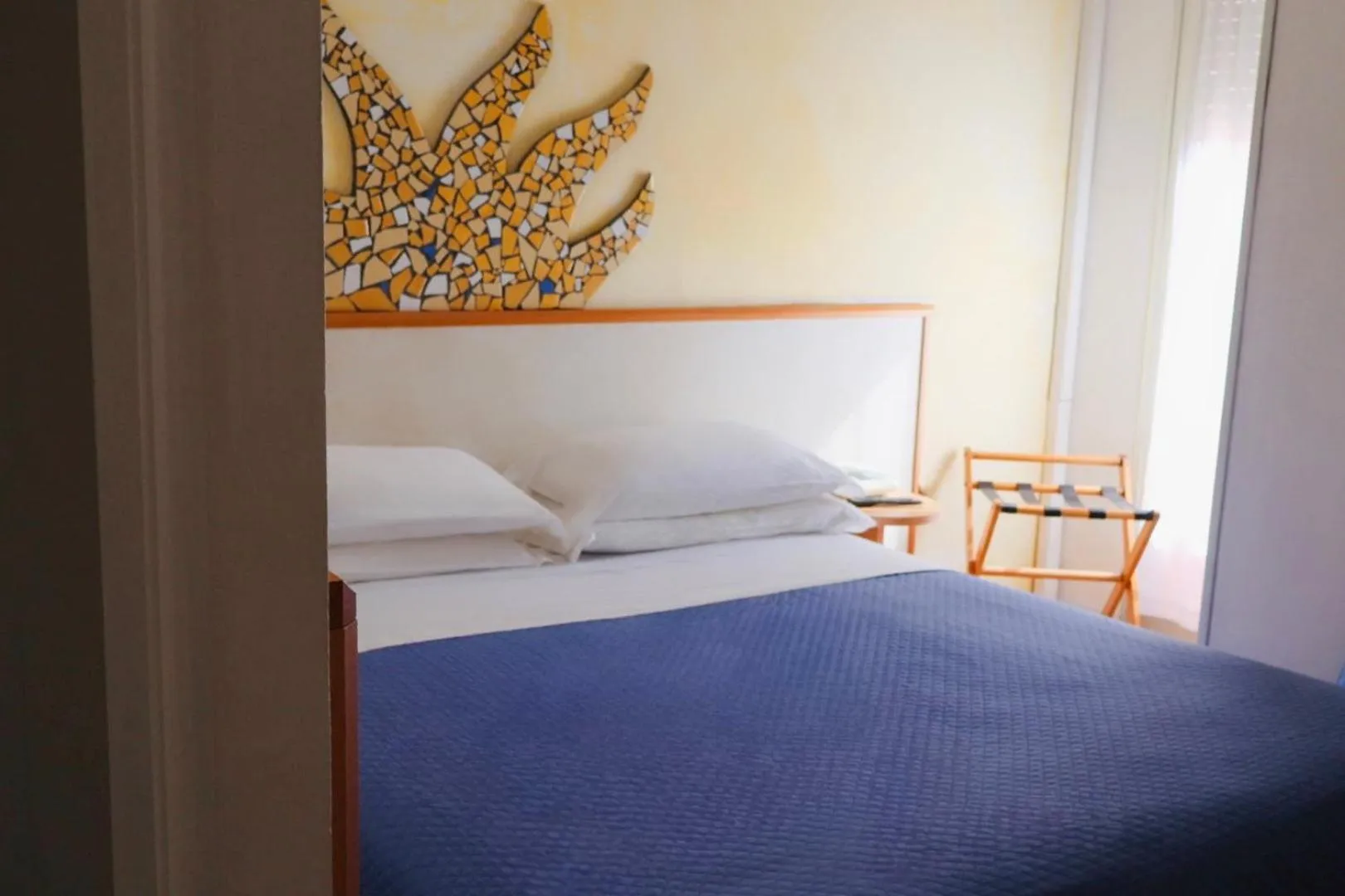 Bed in Hotel Giorgetti Orange