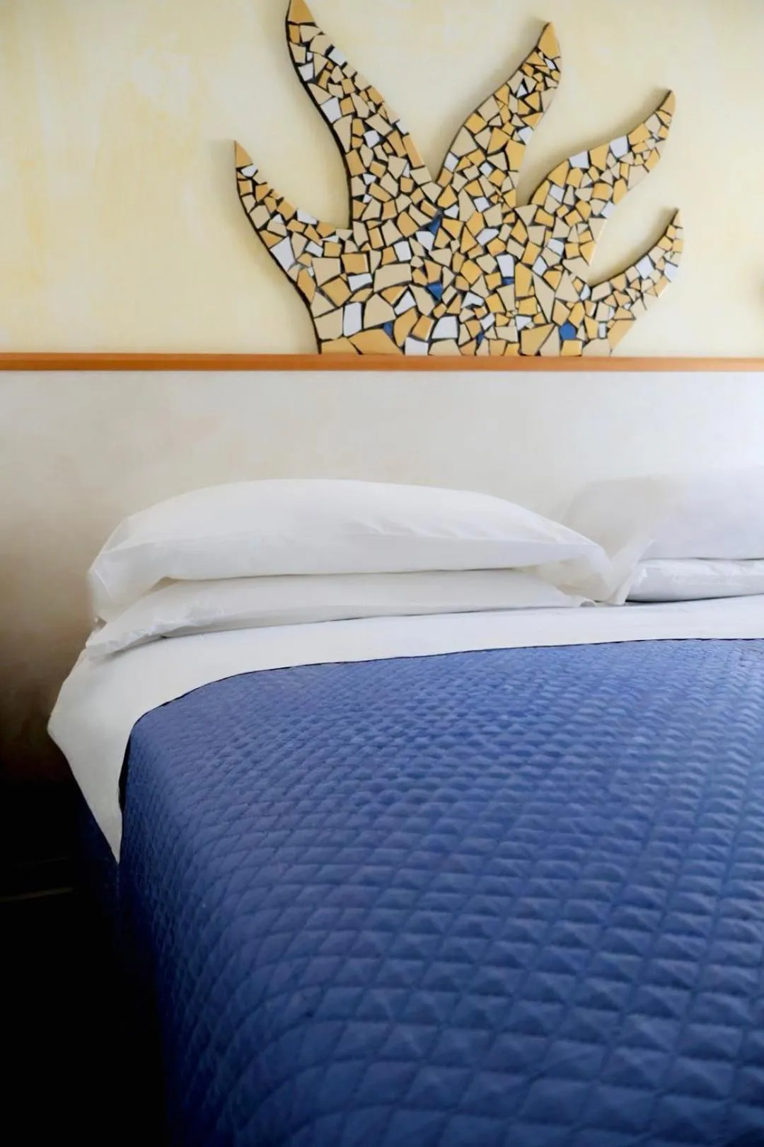 Bed in Hotel Giorgetti Orange