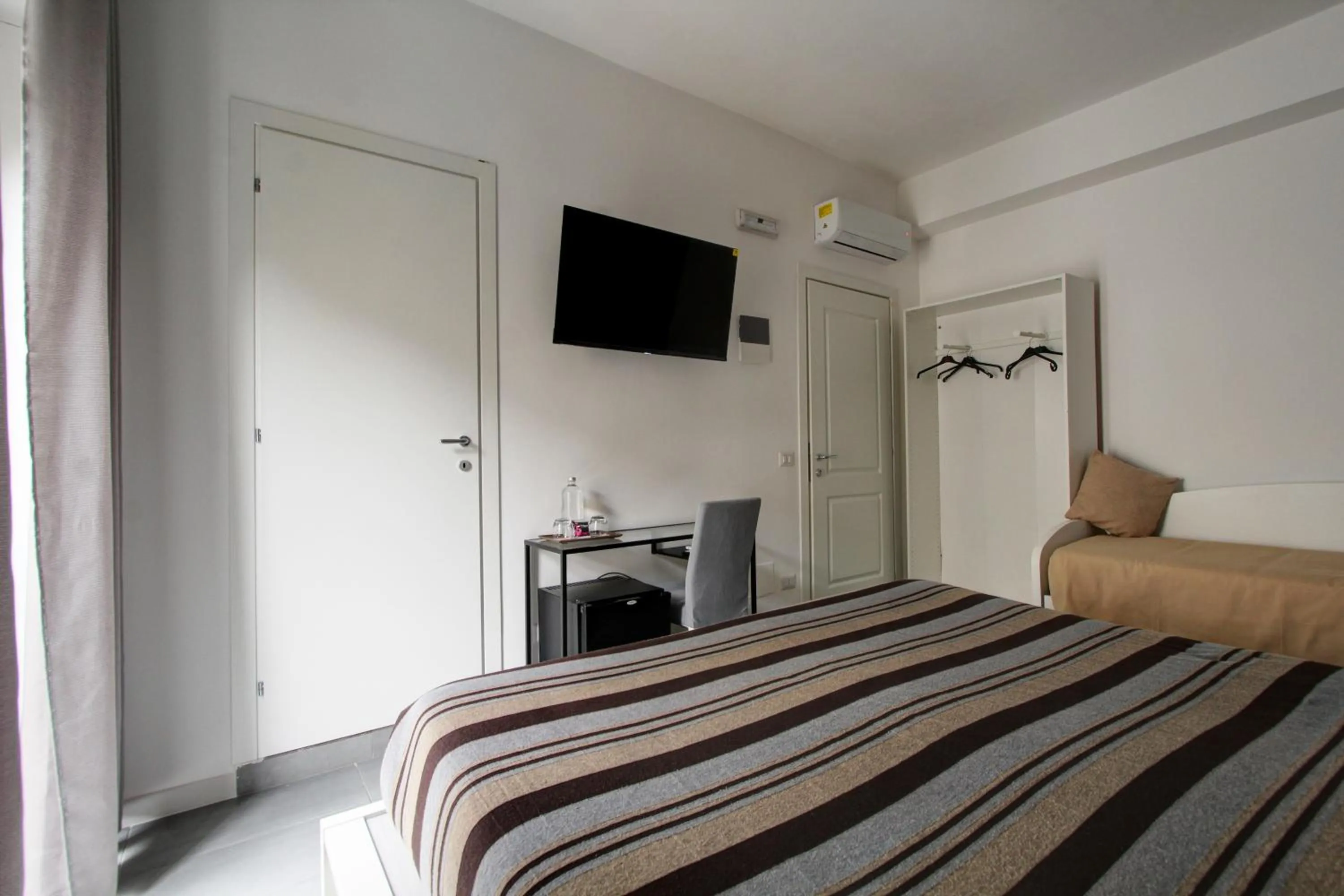 Bed in Vatican Central Suites