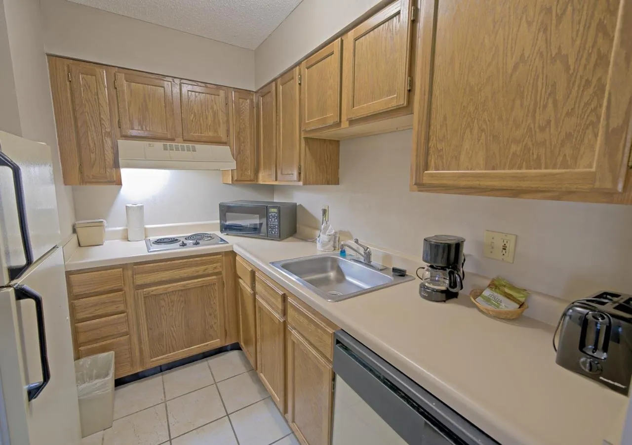 Kitchen or kitchenette in All Season Suites