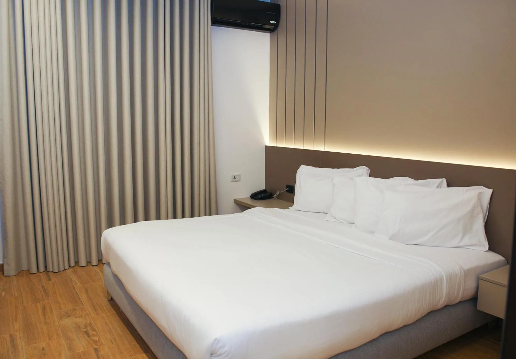 Bed in Spark Plaza Hotel