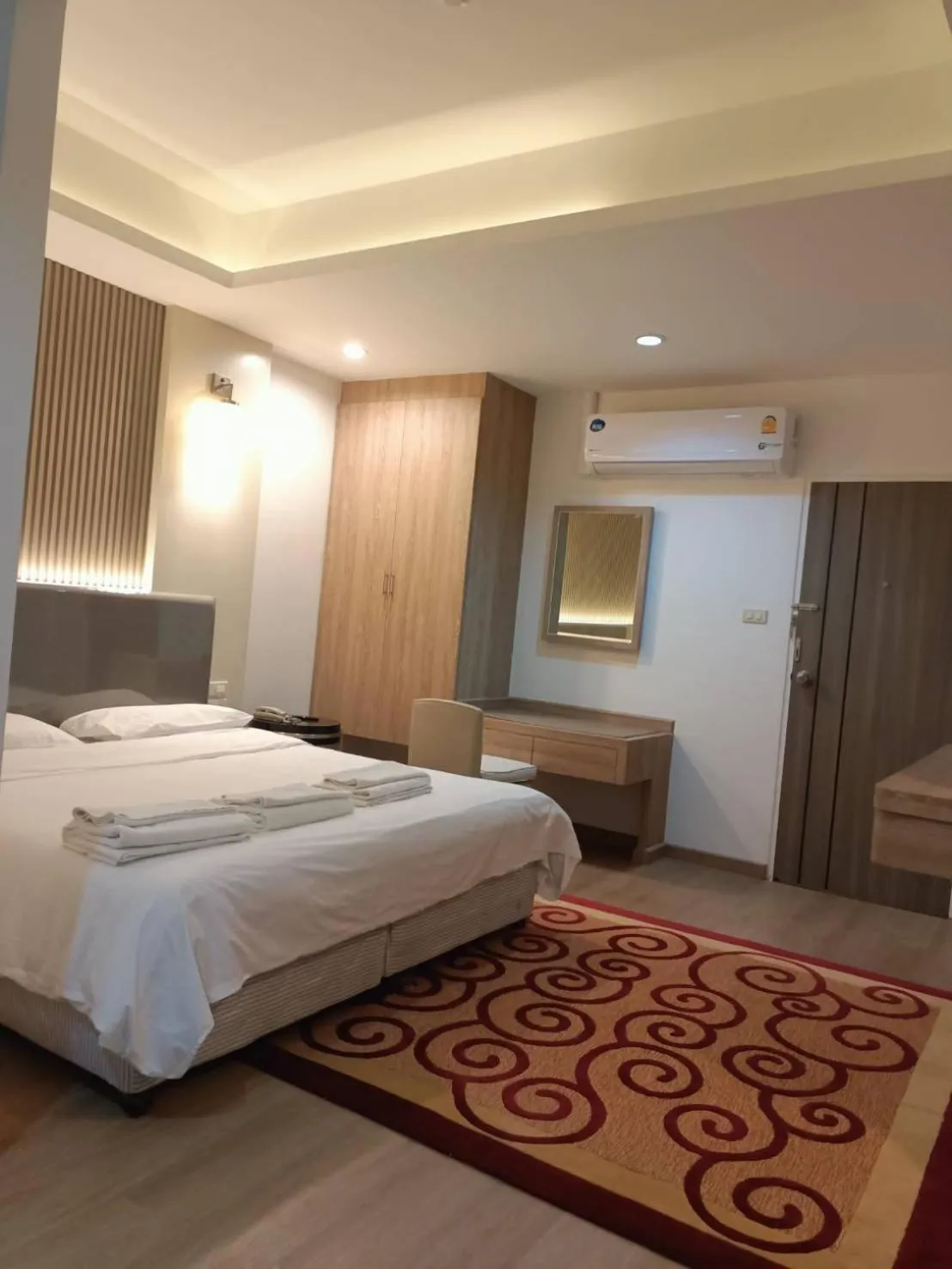 Bed in Royal Garden Home Hotel