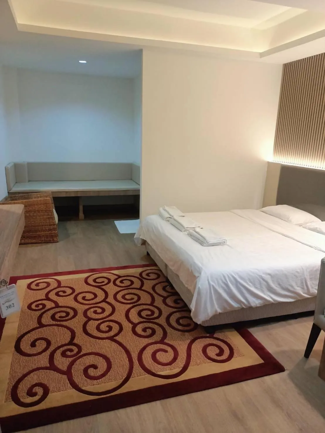 Bed in Royal Garden Home Hotel