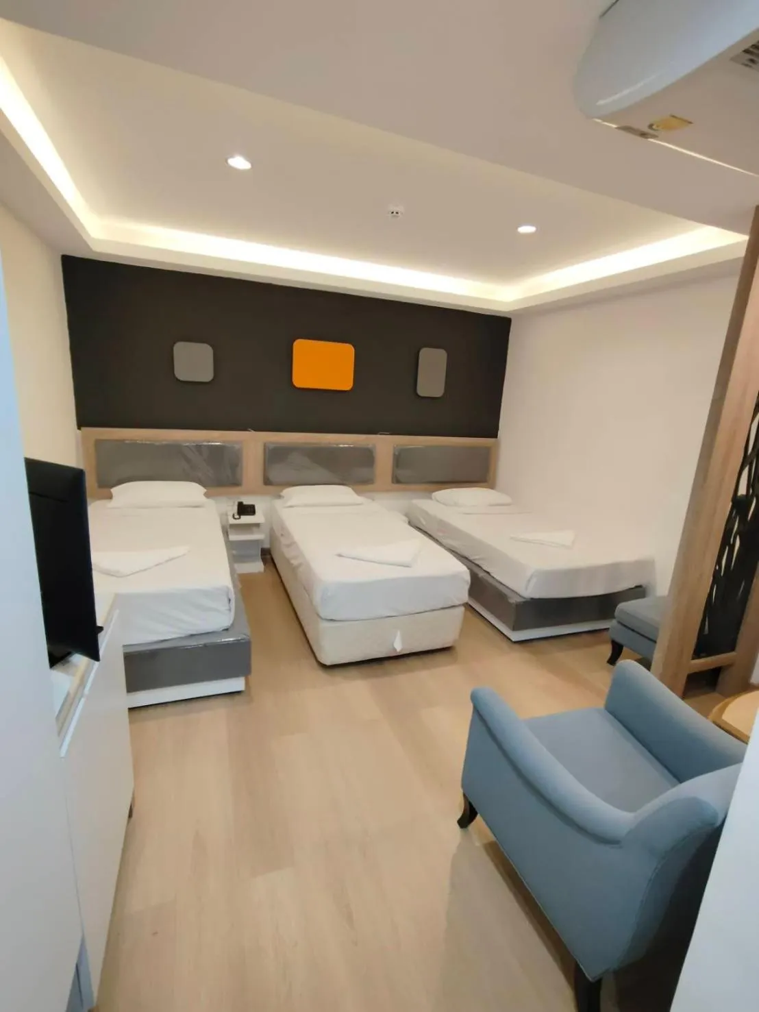 Bed in Royal Garden Home Hotel