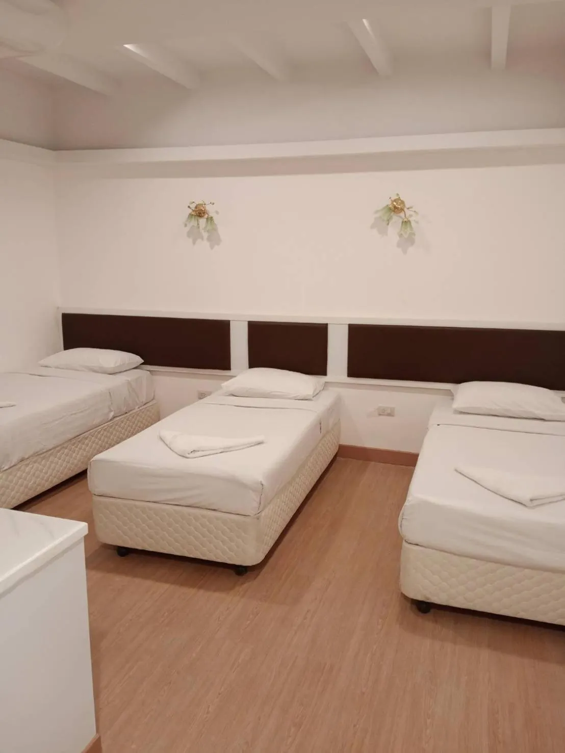 Bed in Royal Garden Home Hotel