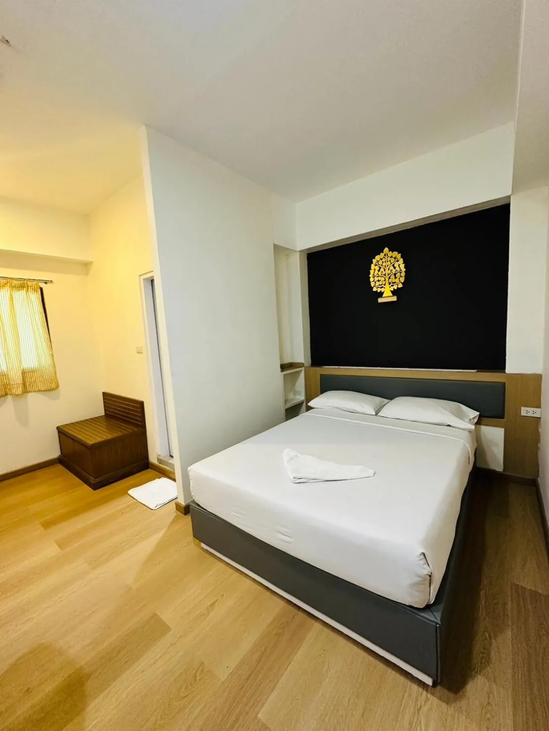 Bed in Royal Garden Home Hotel